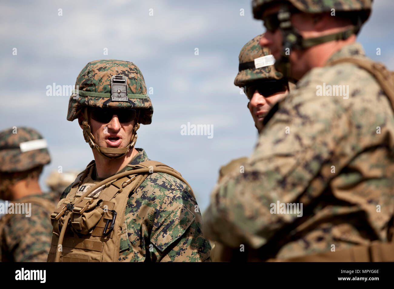 U.S. Marine Corps Capt. Adam S. Young, left, company commander of India company, Advanced Infantry Training Battalion, School of Infantry-East (SOI-E), supervises a combined arms exercise at Camp Lejeune, N.C., April 7, 2017. The mission of SOI-E is to train entry-level and advanced level Marines in the skills required of an Infantry Marine for the operating forces. (U.S. Marine Corps photo by Lance Cpl. Jose Villalobosrocha) Stock Photo