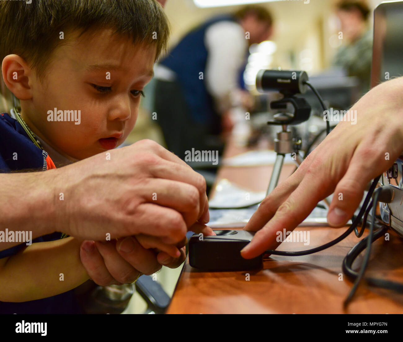 Paul Romehildt has his fingerprint scanned during the 2017 Children’s ...