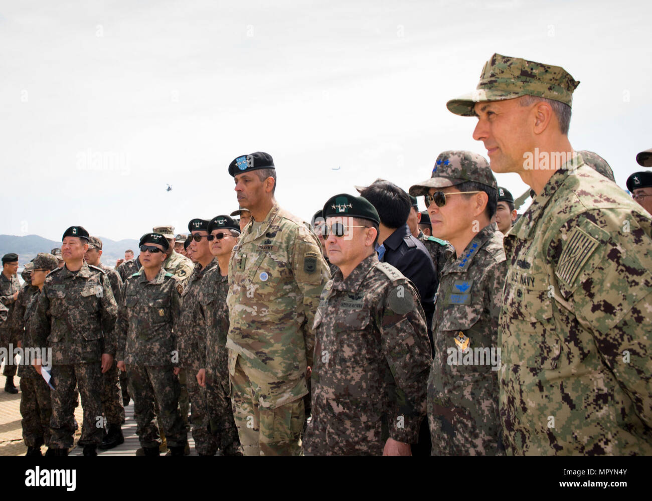 POHANG, Republic of Korea (April 12, 2017) – Rear Adm. Cathal S. O’Connor (right), commander of Expeditionary Strike Group 3, leads Gen. Vincent K. Brooks (left center), United Nations Commander, Combined Forces Commander and United States Forces Korea commander, on a tour of commands taking part in Operation Pacific Reach Exercise 2017 (OPRex17). OPRex17 is a bilateral training event designed to ensure readiness and sustain the ROK-U.S. Alliance by exercising an Area Distribution Center (ADC), an Air Terminal Supply Point (ATSP), Combined Joint Logistics Over-the-Shore (CJLOTS), and the use o Stock Photo