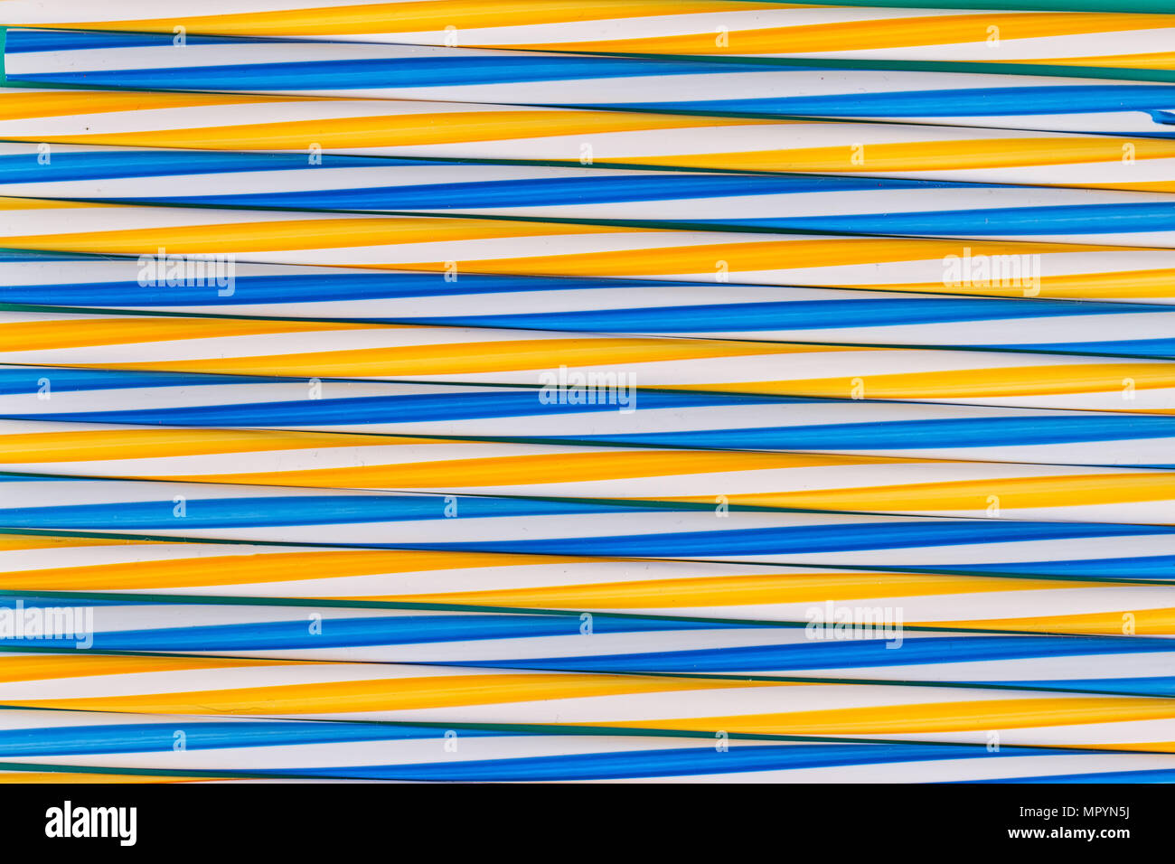 Background stripes multicolored smoothies plastic cocktail straws Stock Photo
