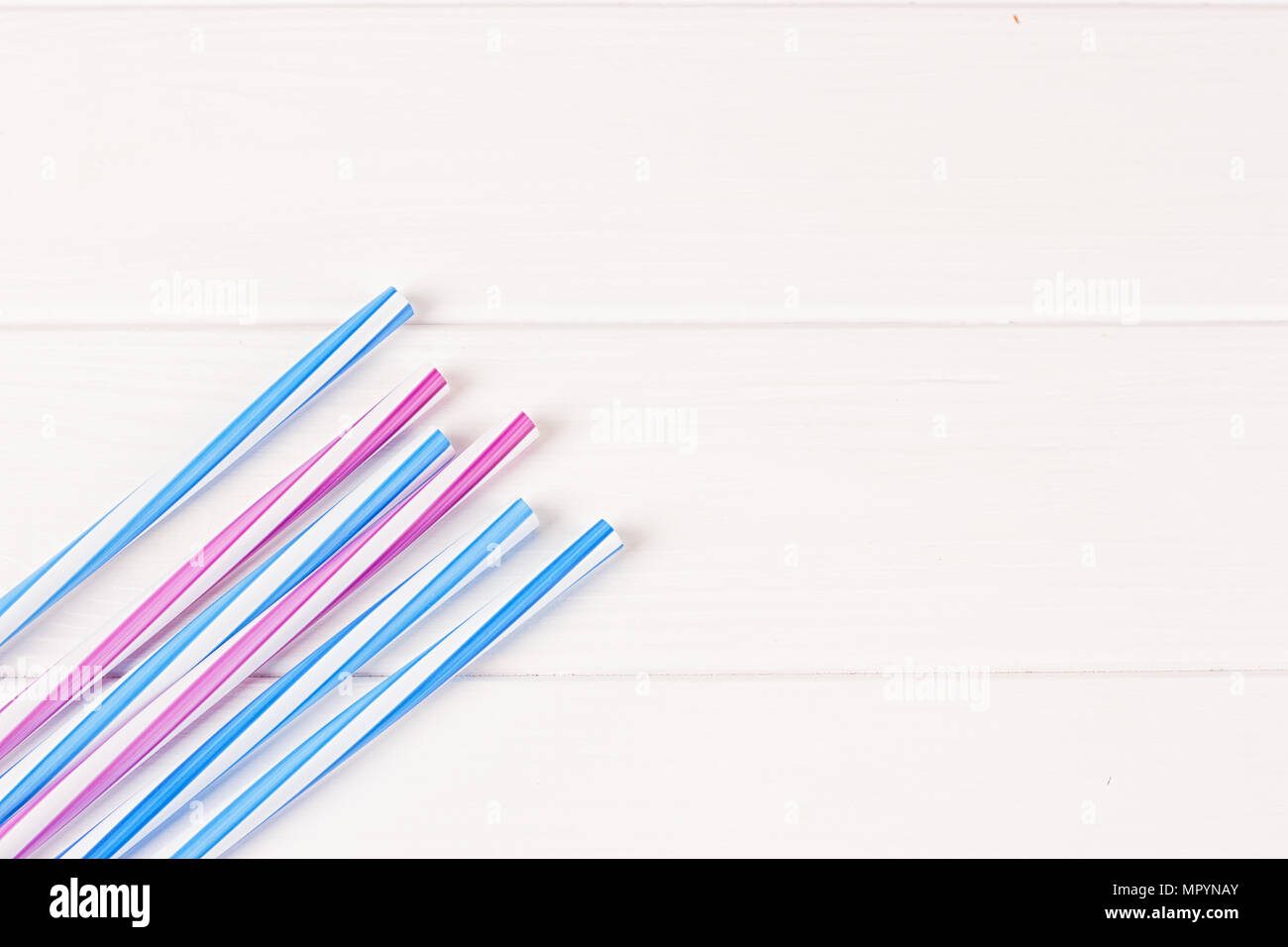 Multicolor cocktail tubes on white background. Close up Stock Photo