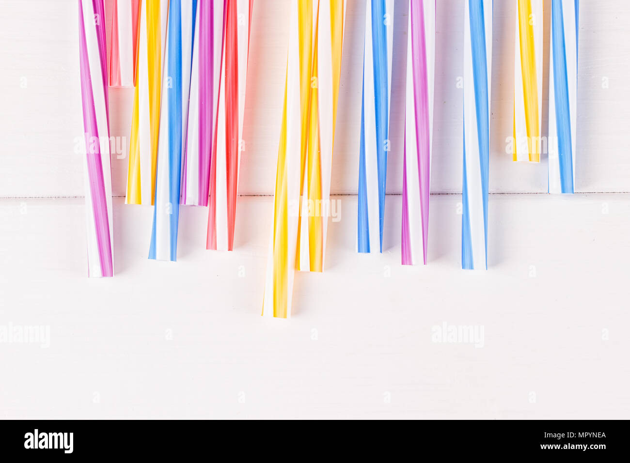 Multicolor cocktail tubes on white background. Close up Stock Photo