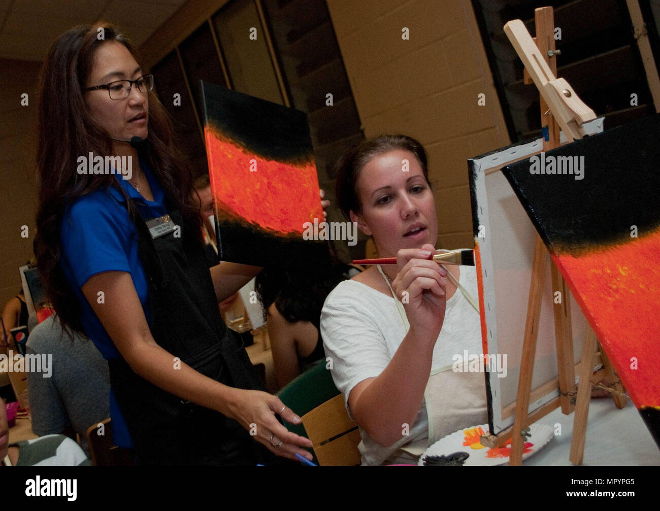 SCHOFIELD BARRACKS — Dania Wong (left), an art instructor at the