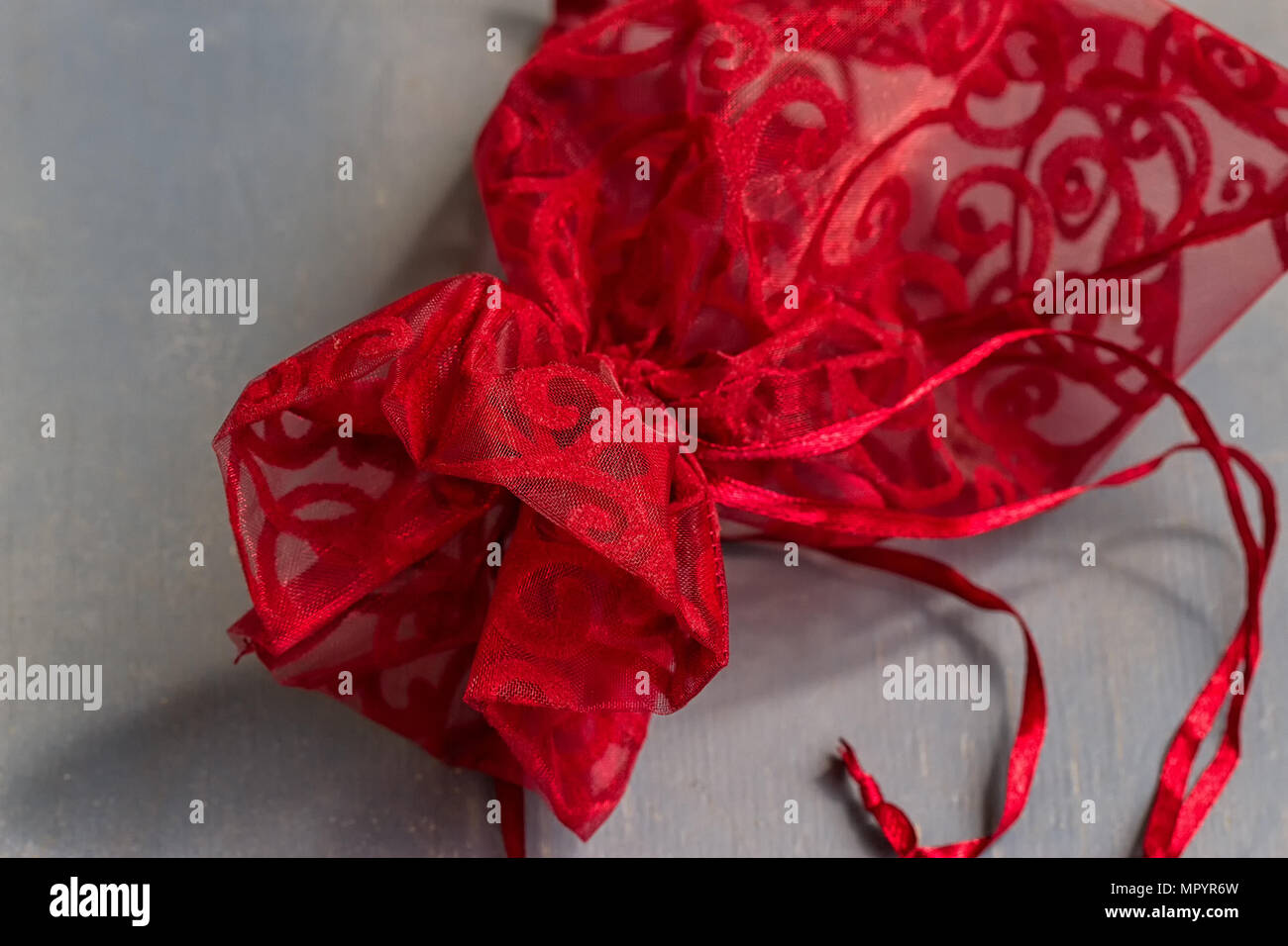 Red drawstring bag On a gray-blue background Stock Photo