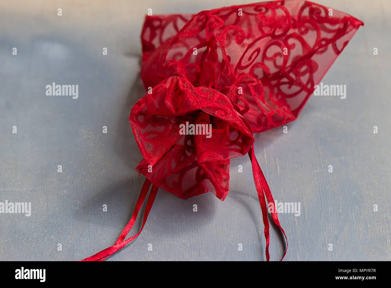 Red drawstring bag On a gray-blue background Stock Photo