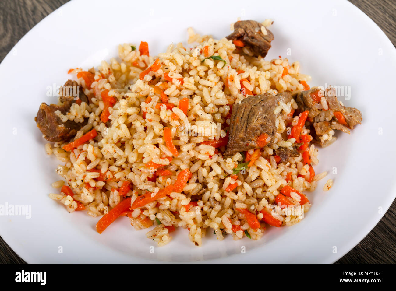 Asian rice - Plov with meat and carrot Stock Photo - Alamy
