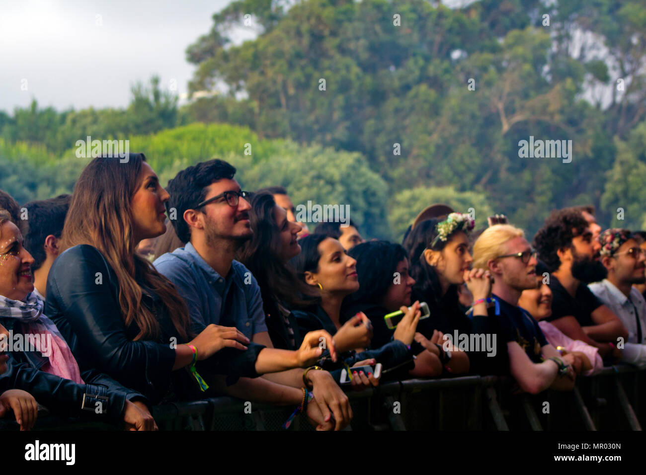 Audience in front row at festival concert Stock Photo