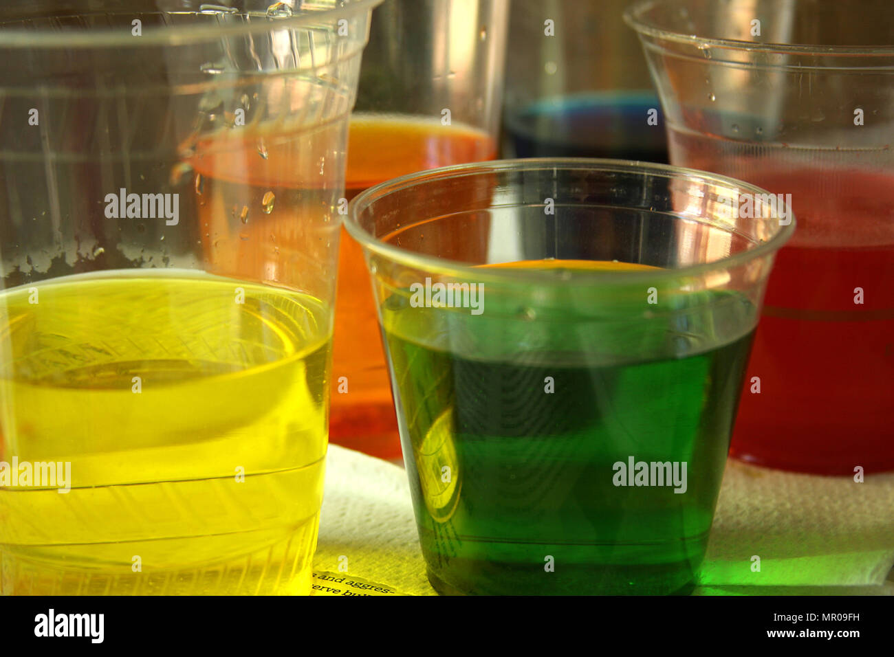 Easter egg dye in plastic cups Stock Photo