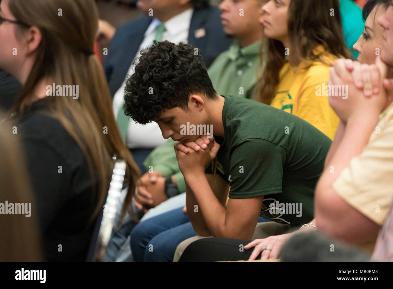 A school shooting survivor listens as Texas Gov. Greg Abbott hosts a Capitol panel studying school safety and student mental health issues in the wake of the March 2018 Santa Fe school shooting that left ten dead. Santa Fe HS students and parents attended the panel. Stock Photo