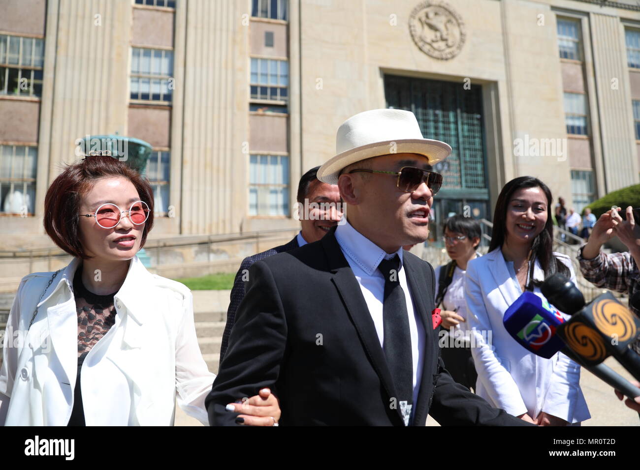 New York, USA. 24th May, 2018. Comedian Zhou Libo speaks to reporters after a court session in Nassau County, the United States, May 24, 2018. A New York state judge on Thursday suppressed evidence in charges against Zhou Libo. Credit: Qiu Junzhou/Xinhua/Alamy Live News Stock Photo