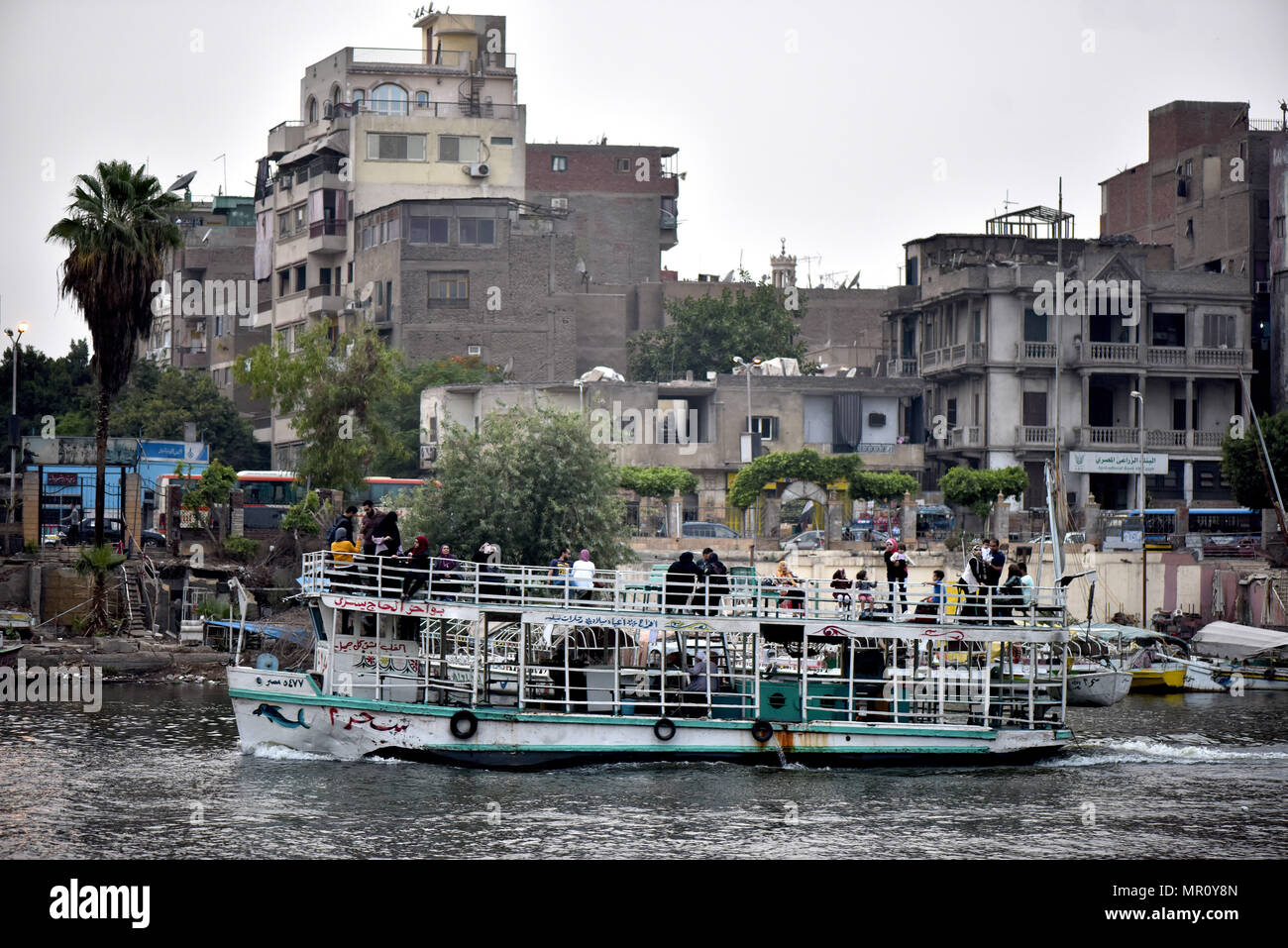 Cruise ship with passengers aboard the river Nile in Cairo, in the ...