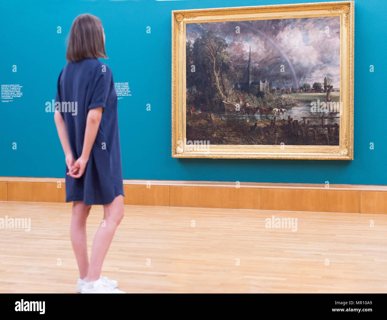 Tate Britain, London, UK. 25 May, 2018. Constable’s Salisbury Cathedral from the Meadows 1831 is shown alongside Turner’s Caligula’s Palace and Bridge, also 1831, in a new display, Fire and Water, marking the first pairing of these two works since they were exhibited over 180 years ago. Credit: Malcolm Park/Alamy Live News. Stock Photo