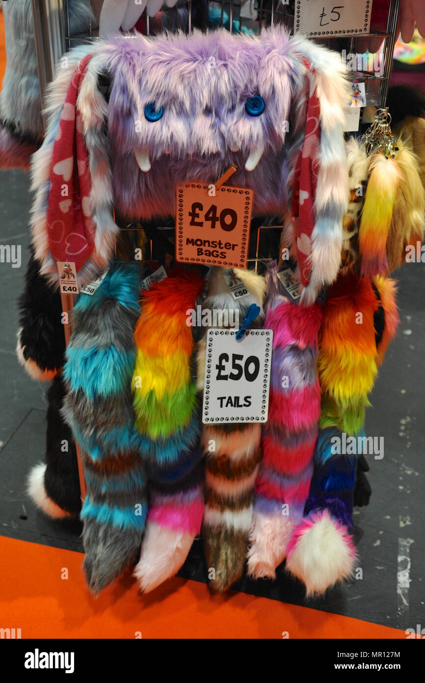 Furry bags and tail accessories on sale on the opening day of MCM London Comic Con at the ExCel Centre in East London, UK.  Tens of thousands of cosplay enthusiasts  attended the show and more than 130,000 are expected to walk through the doors by the end of the three-day event which finishes on Sunday. Credit: Michael Preston/Alamy Live News Stock Photo