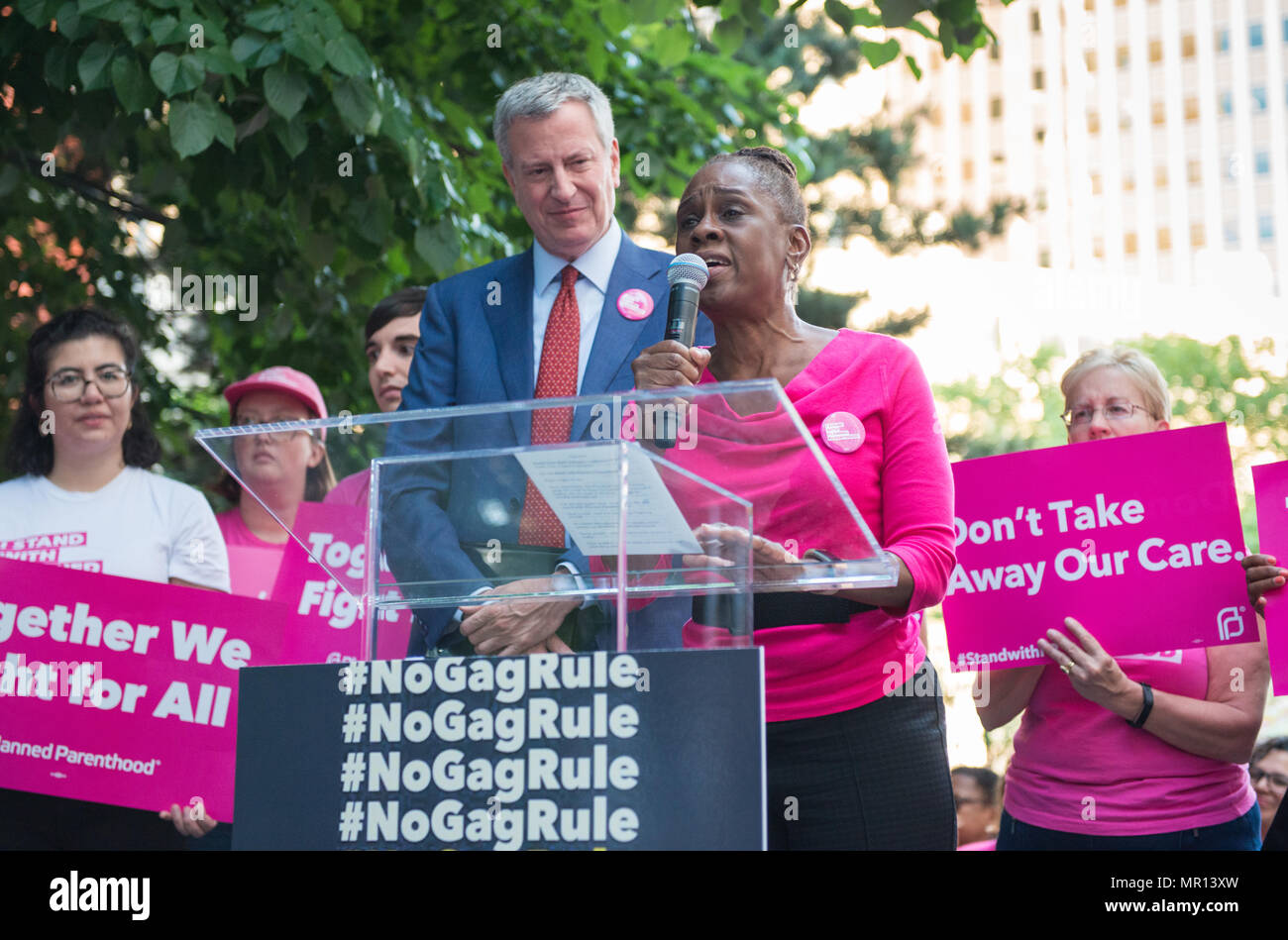 New York, USA. 24th May 2018. First Lady of New York City Chirlane McCray (with husband Mayor Bill DeBlasio in background) speaks at Title X (Title Ten) gag rule rally in New York City, hosted by Planned Parenthood of New York City on May 24th 2018, reacting the President Trump's attempt to ban Medicaid and federal funding to medical providers who provide full, legal medical information to patients wanting or needing abortion services. Credit: Brigette Supernova/Alamy Live News Stock Photo