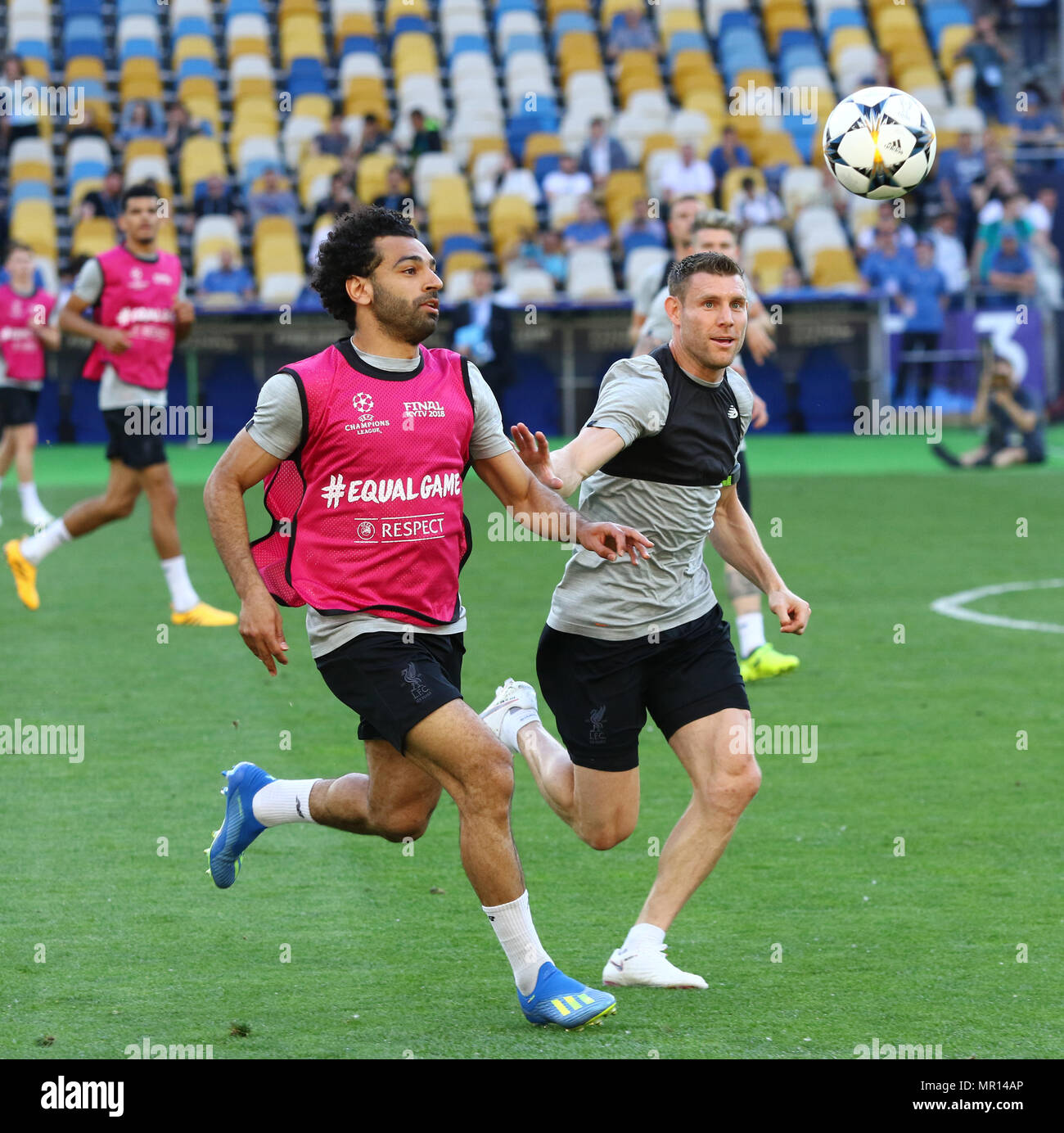 Kiev, Ukraine. 25th May, 2018. Mohamed Salah (L) and James Milner of Liverpool fight for the ball during training session before UEFA Champions League Final 2018 game against Real Madrid at NSC Olimpiyskiy Stadium in Kyiv, Ukraine. Credit: Oleksandr Prykhodko/Alamy Live News Stock Photo