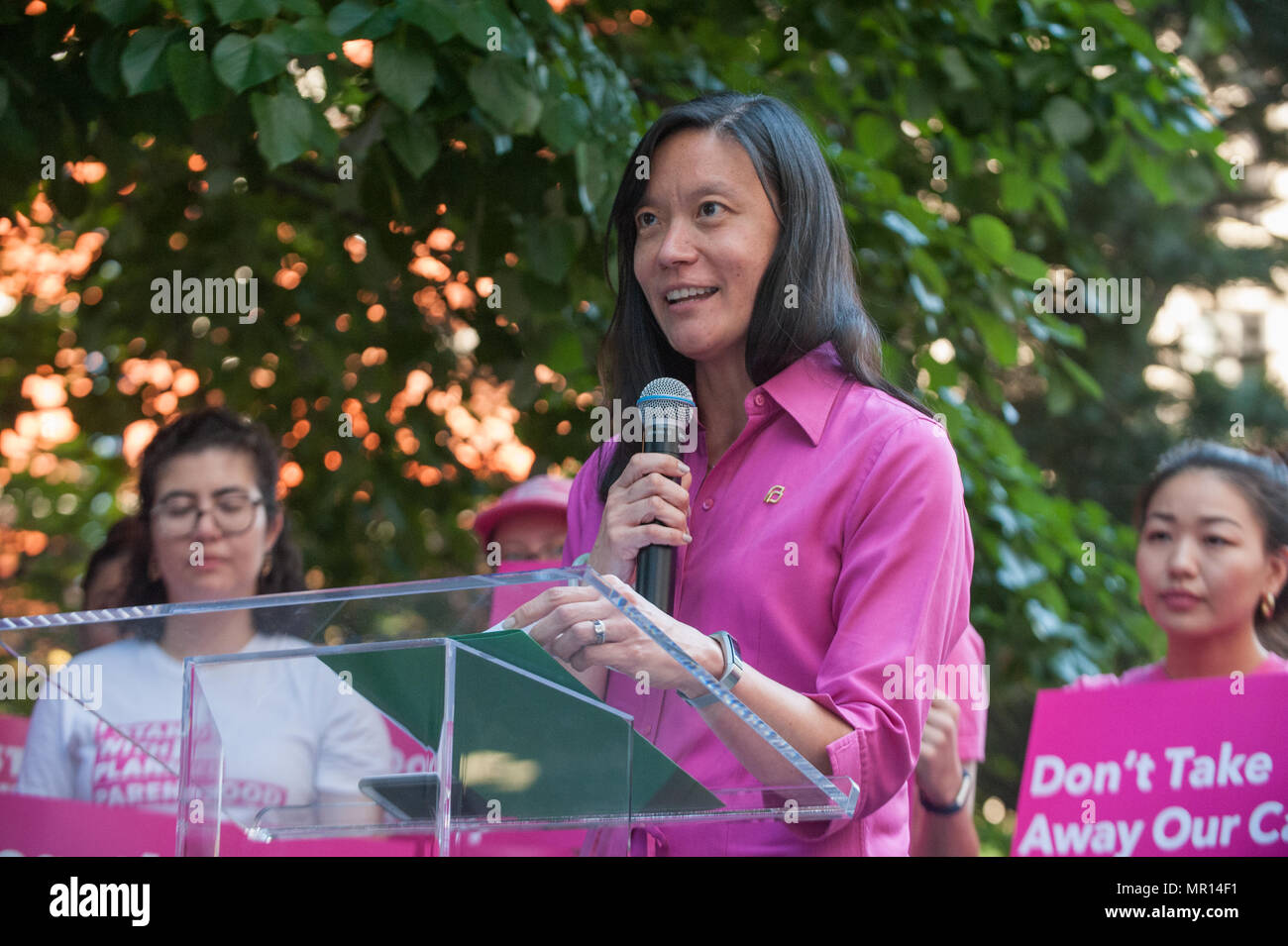 Christina Chang (Planned Parenthood NYC Chief of External Affairs) speaks at Title X (Title Ten) gag rule rally in New York City, hosted by Planned Parenthood of New York City on May 24th 2018, reacting the President Trump's attempt to ban Medicaid and federal funding to medical providers who provide full, legal medical information to patients wanting or needing abortion services. Stock Photo