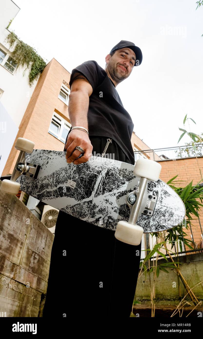 25 May 2018, Germany, Hamburg: US fashion designer Chris Stamp with the  skateboard from his collection for Ikea at an Ikea pop-up store. The  collection is limited-edition, the pop-up store in Hamburg