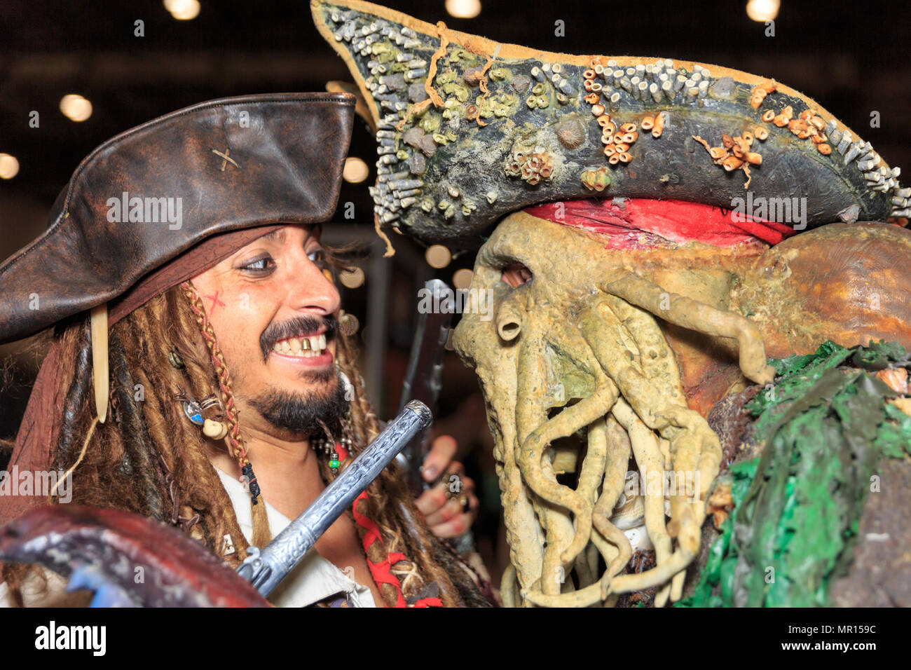 ExCel, London, 25th May 2018. Character cosplayers as Captain Jack Sparrow and Dead Man's Chest from the Pirates of the Caribbean. into pose. Cosplayers, Comic Characters, Superheros and costumed visitors come together for MCM Comicon's London Opening Day 2018, running at ExCel Exhibition Centre May 25-27th. Credit: Imageplotter News and Sports/Alamy Live News Stock Photo