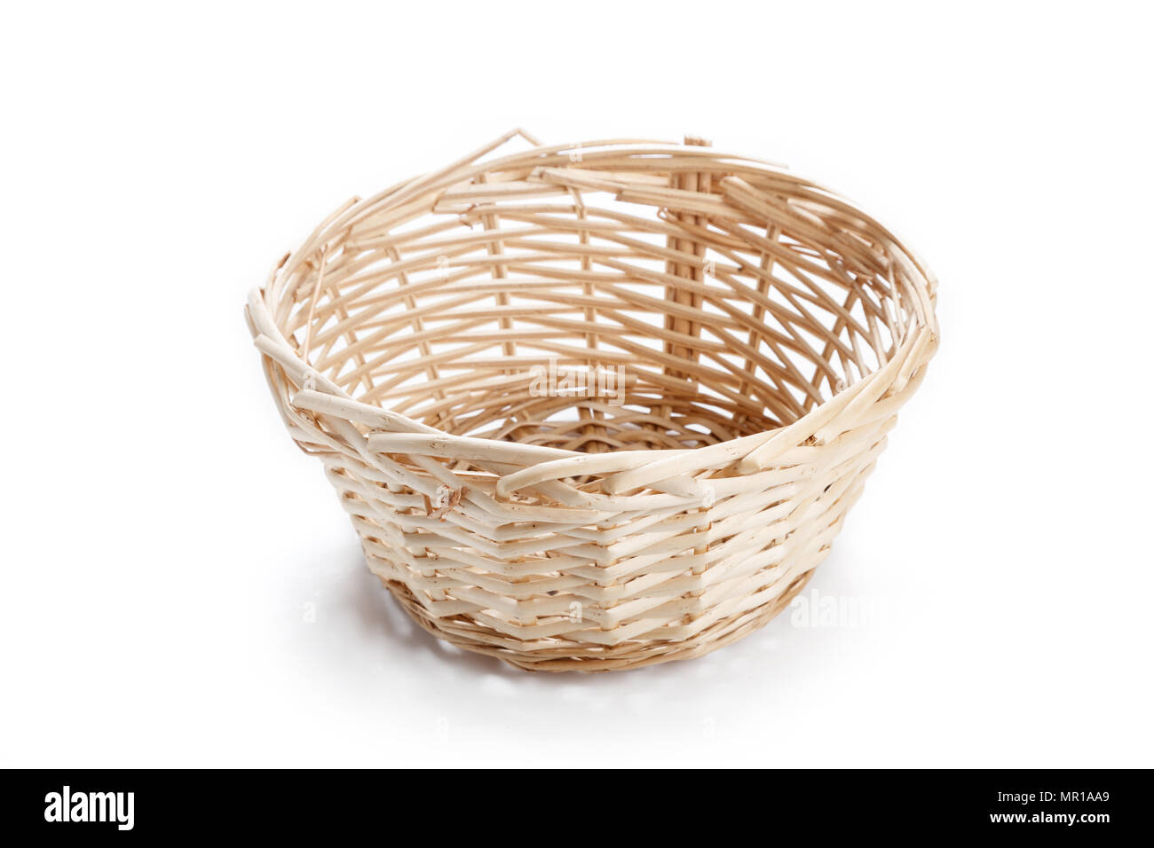 A wicker basket isolated on white background Stock Photo - Alamy