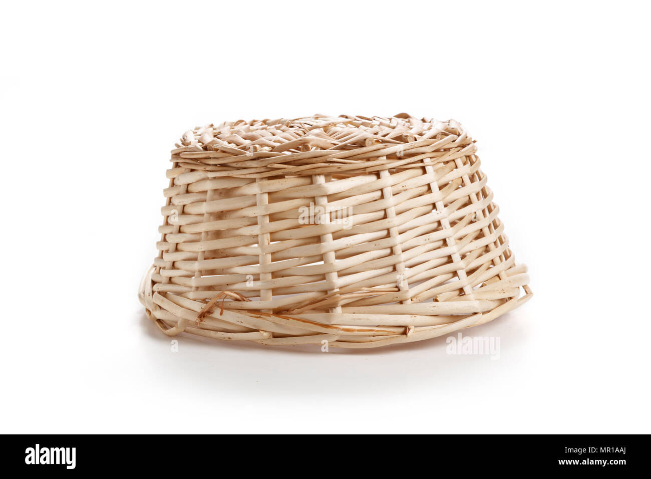 A wicker basket isolated on white background Stock Photo - Alamy