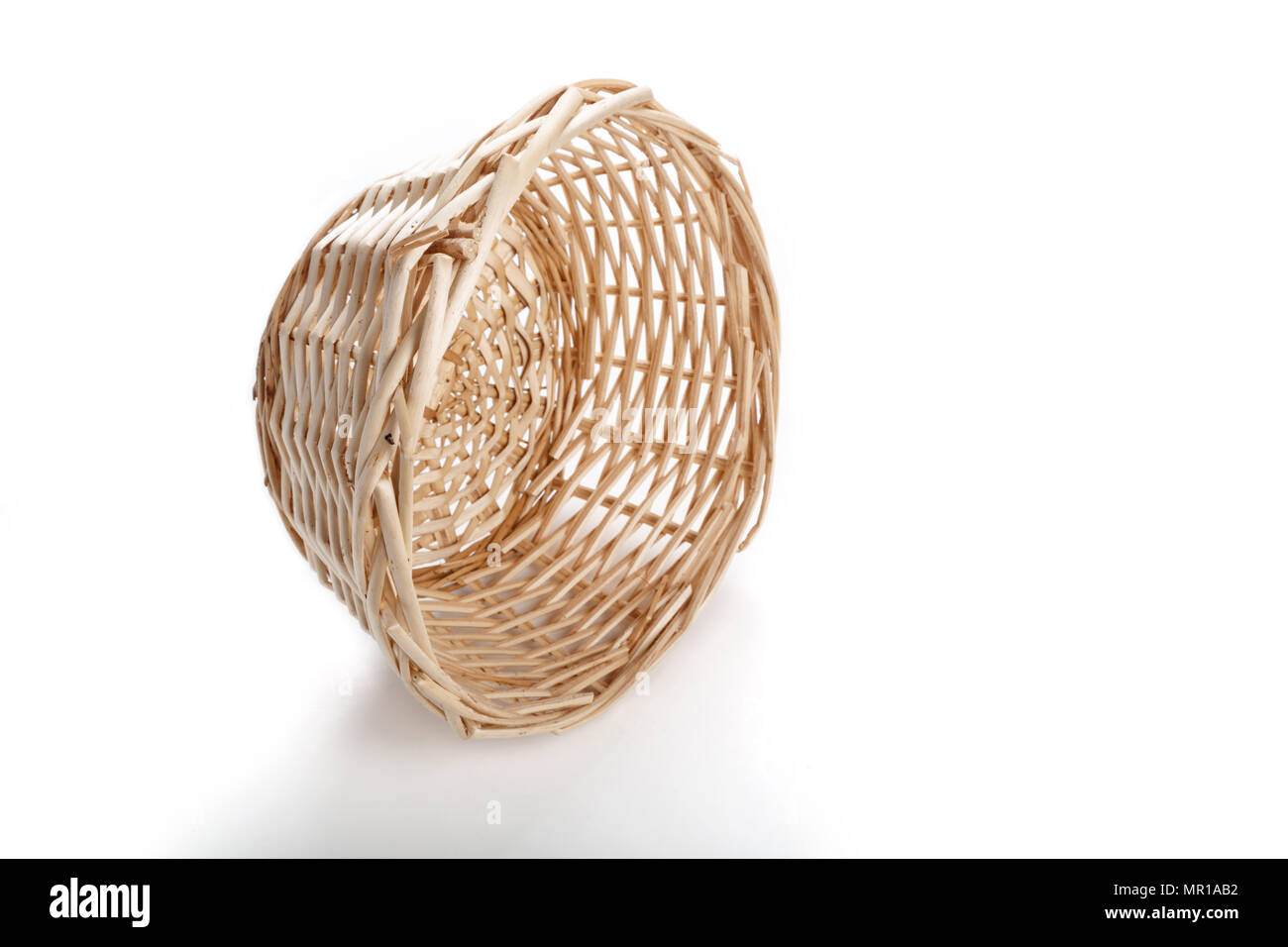 A wicker basket isolated on white background Stock Photo - Alamy