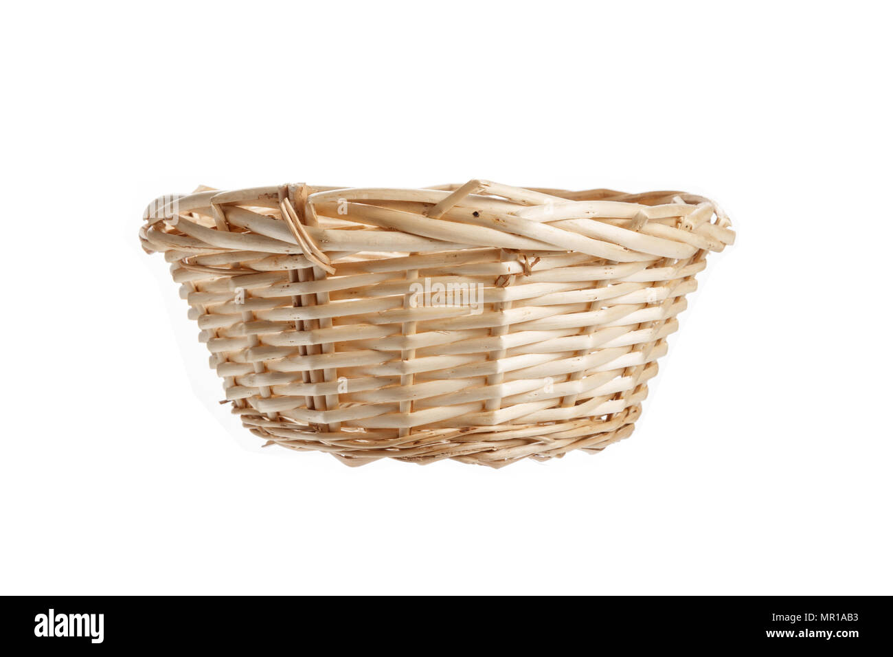 A wicker basket isolated on white background Stock Photo - Alamy