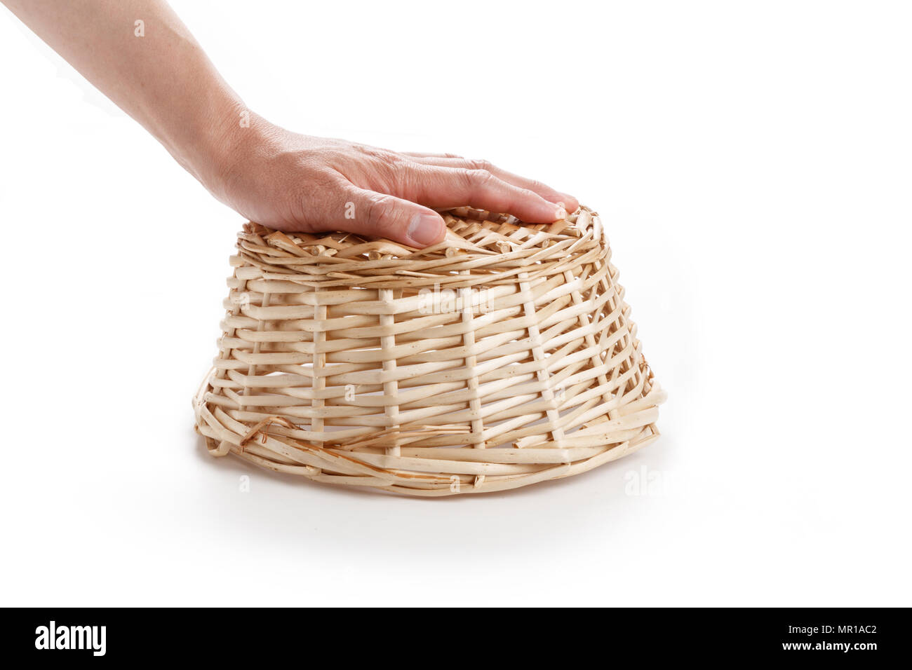 A wicker basket isolated on white background Stock Photo - Alamy