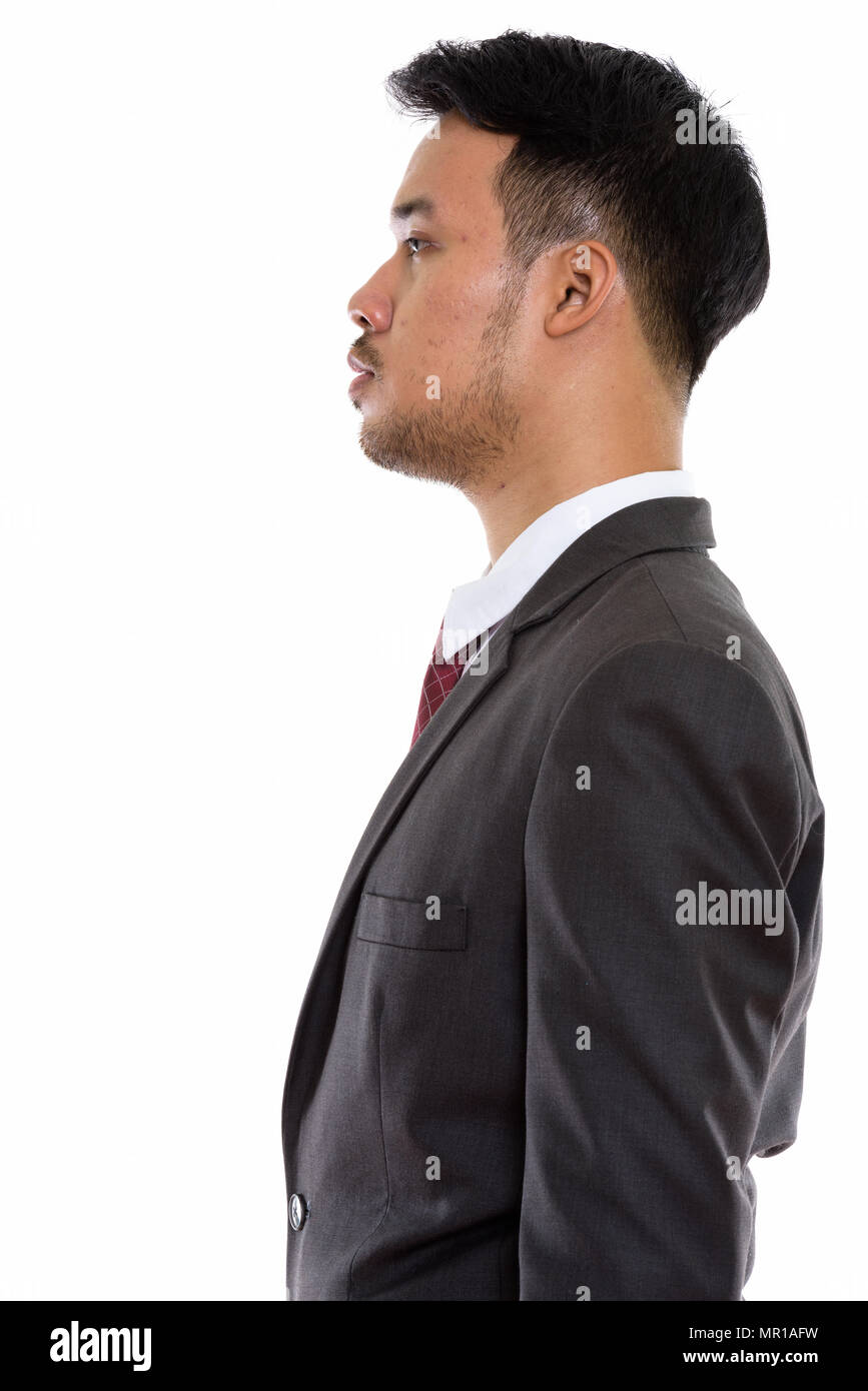 Profile view of young Asian businessman Stock Photo