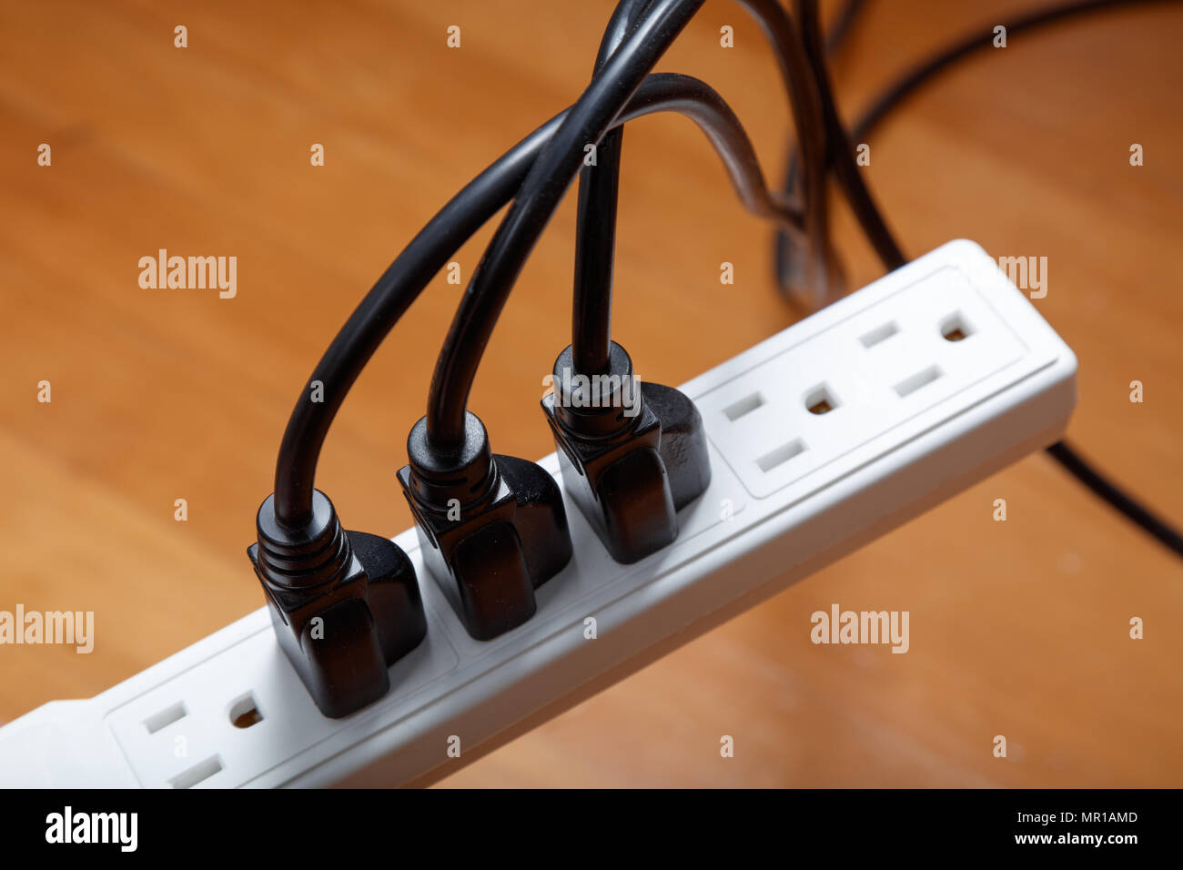 electrical plugs connected to a power strip Stock Photo Alamy