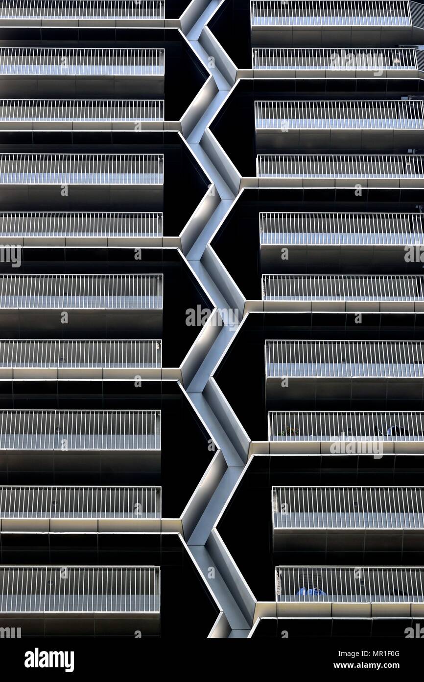 Front view of modern exterior of unique multi story car park in downtown Singapore with stunning textures of steel and geometric patterns Stock Photo