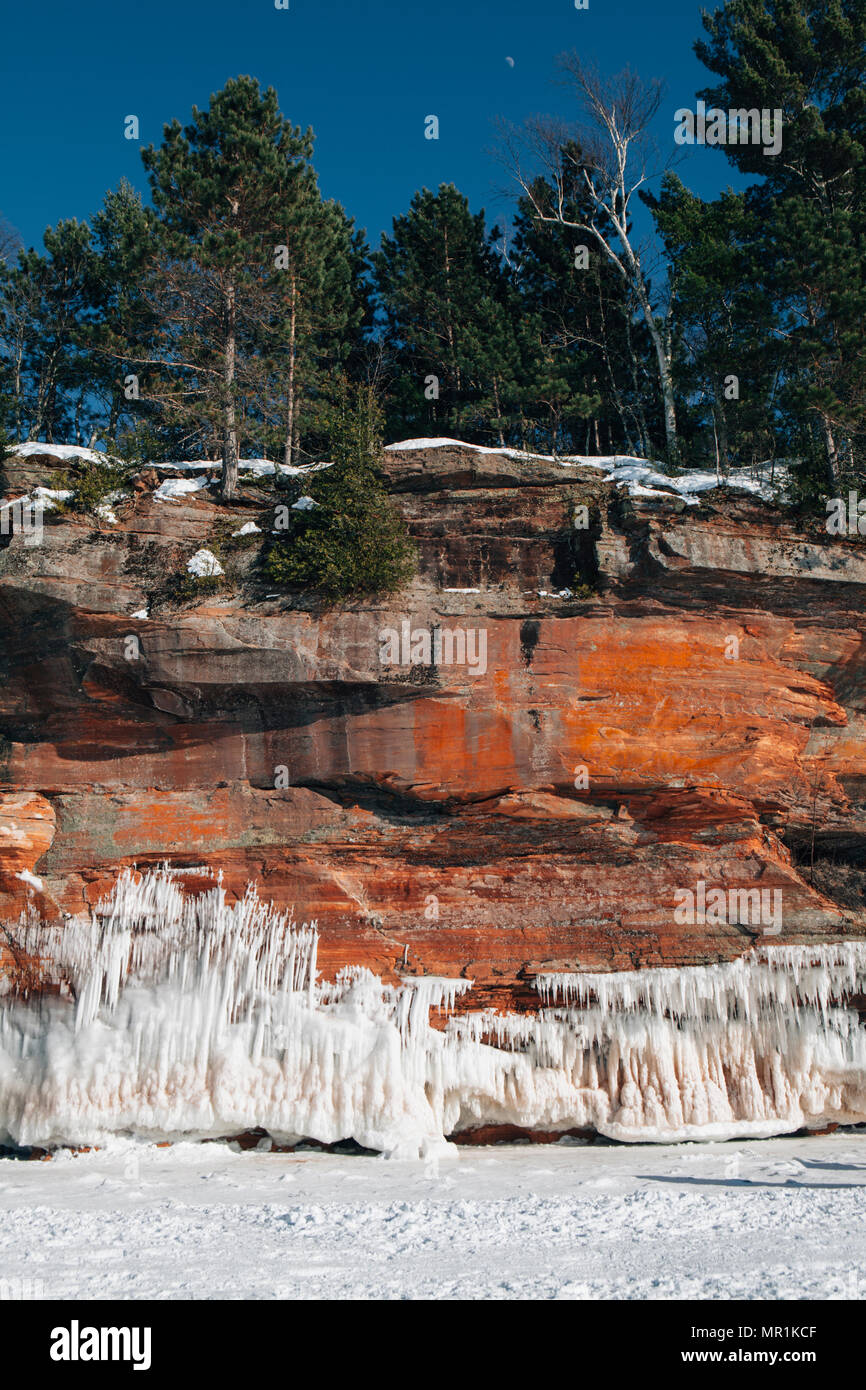 Red rock caves are ice covered along the shoreline of the Apostle Islands National Lakeshore, Bayfield, Wisconsin, USA Stock Photo