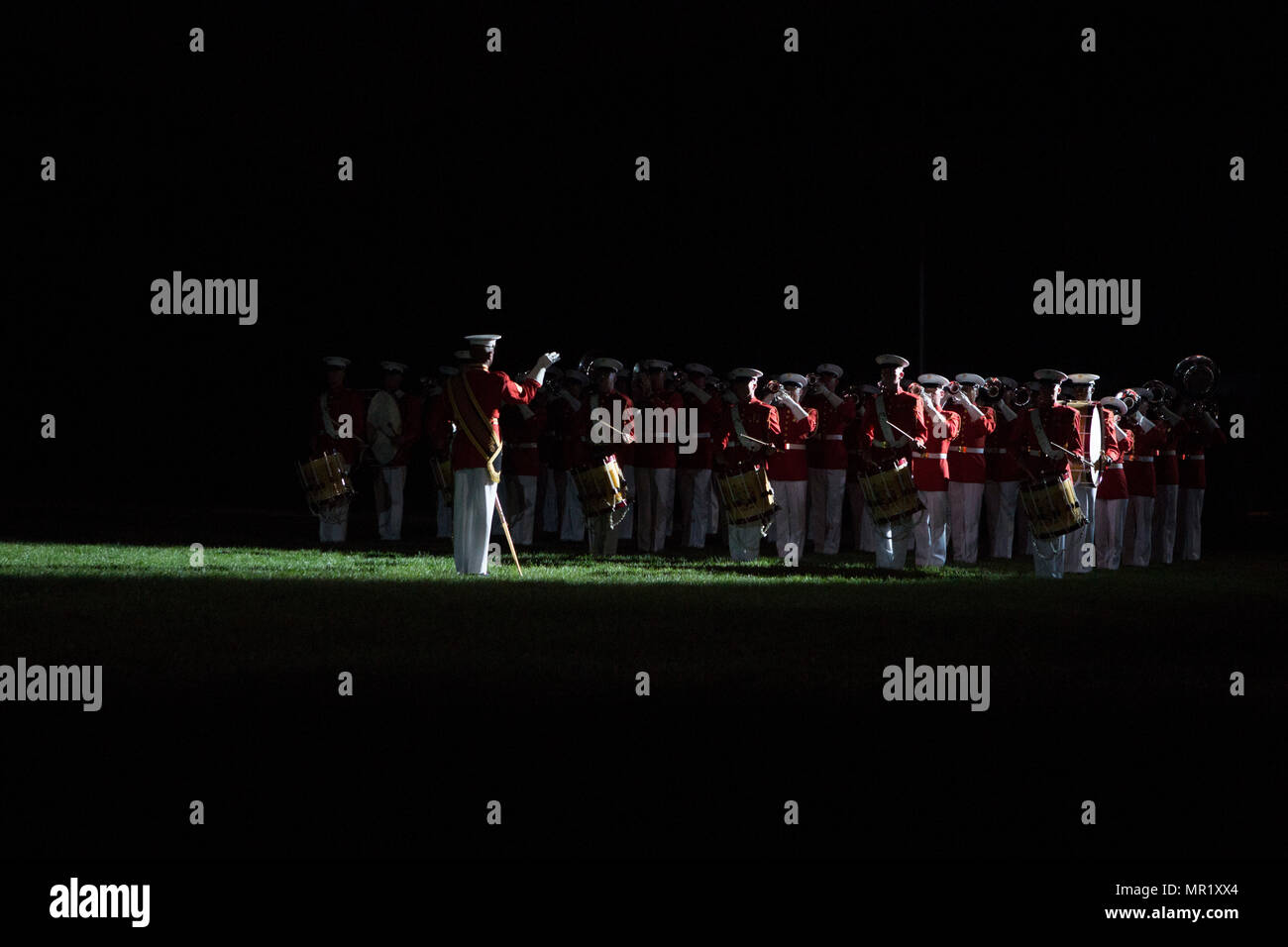 The United States Marine Drum and Bugle Corps provides musical support for  Marine Corps ceremonies and parades at Marine Barracks Washington. The  archival image records a ceremonial performance during an Evening Parade
