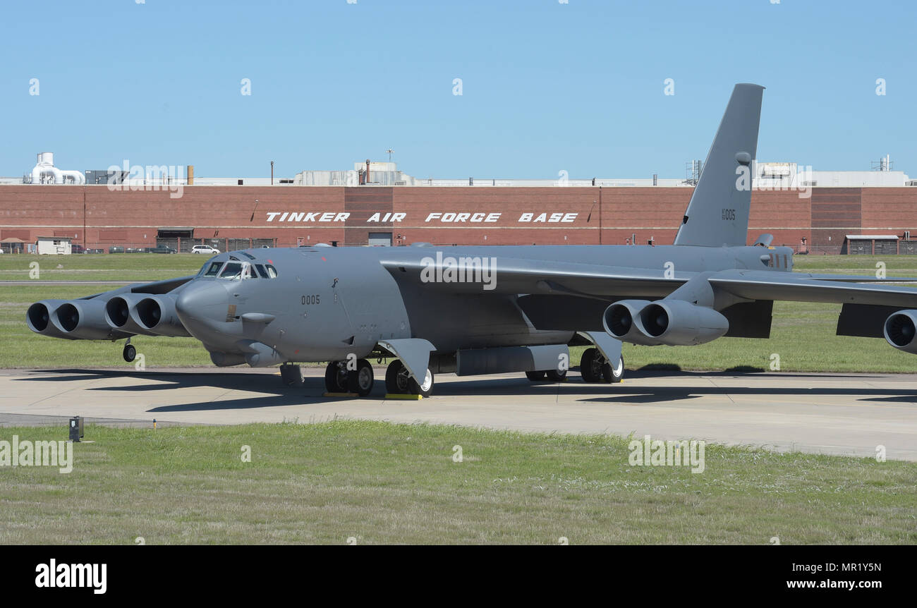 Boeing B-52H Stratofortress, 60-0005, poses in front of  Oklahoma City Air Logistics Complex Bldg. 3001 following major overhaul on May 1, 2017, Tinker Air Force Base, Oklahoma. OC-ALC is responsible for depot level maintenance of the B-52 fleet as well as the B-1B Lancer and KC-135 Stratotanker and a large portion of the work takes place in the almost one-mile long building. (U.S. Air Force photo/Greg L. Davis) Stock Photo