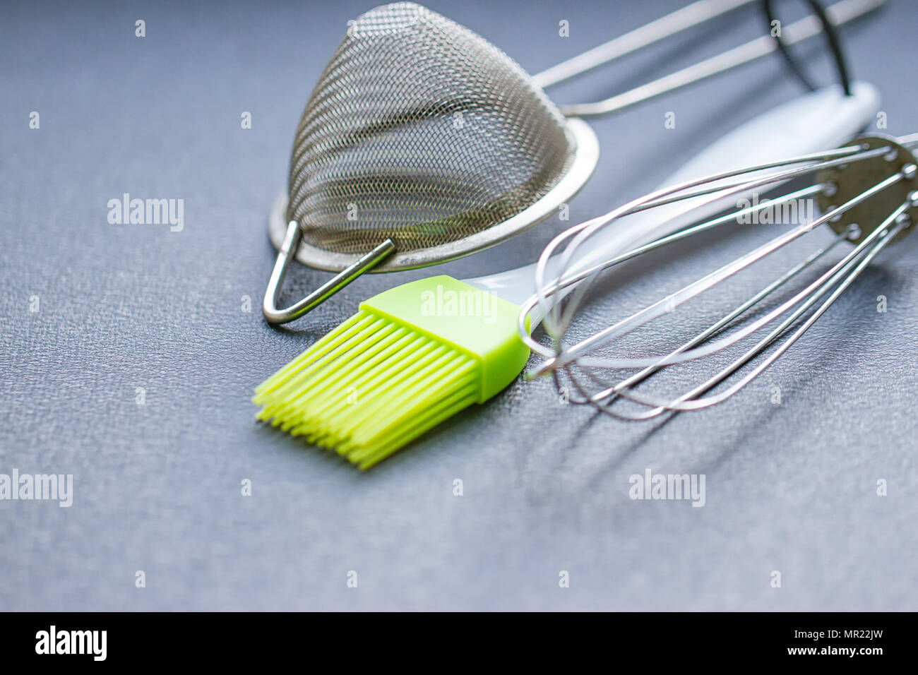 Background of kitchen utensils : Culinary brush, whisk spatula Stock Photo