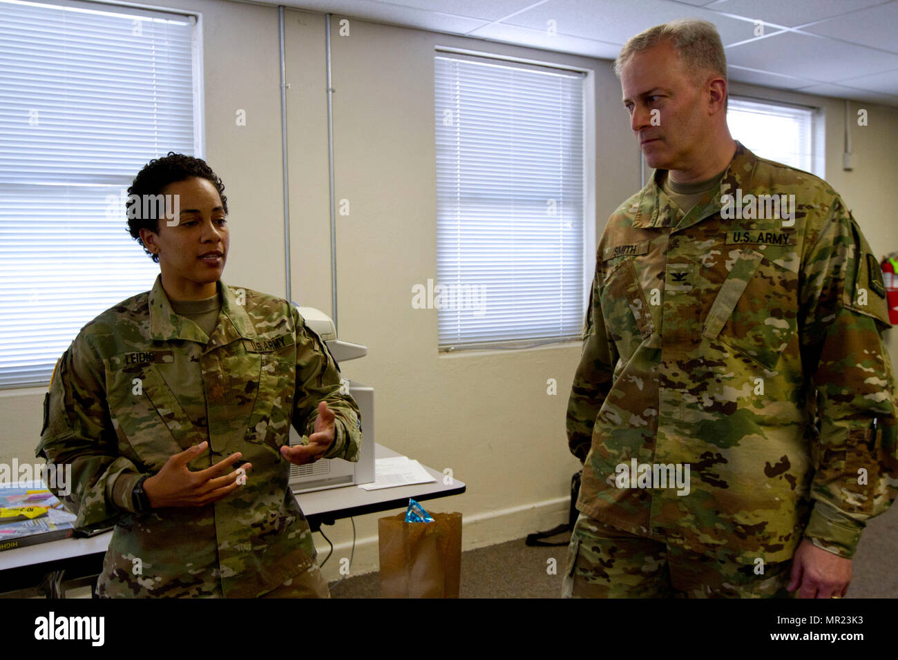 Maj. Ambyr Leidig, a U.S. Army Reserve Soldier assigned to the Army Reserve Cyber Operations Group, Western Cyber Protection Center out of Camp Parks, Ca., briefs Col. Michael D. Smith, commander for the Army Reserve Cyber Operations Group out of Adelphi, Md., during Cyber Shield 17 at Camp Williams, Utah, May 2, 2017. Cyber Shield is a National Guard exercise, in cooperation with U.S. Army Reserve, that provides Soldiers, Airmen and civilians from over 44 states and territories the opportunity to test their skills in response to cyber-incidents in a multi-service environment. (U.S. Army Reser Stock Photo