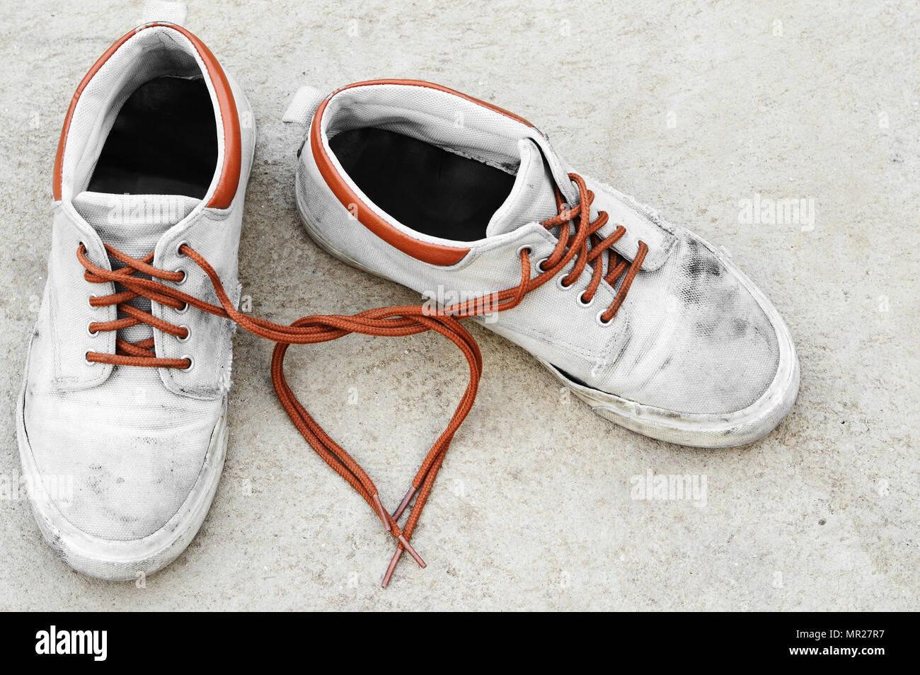 shoelace heart shape of brown dirty sneaker, love background