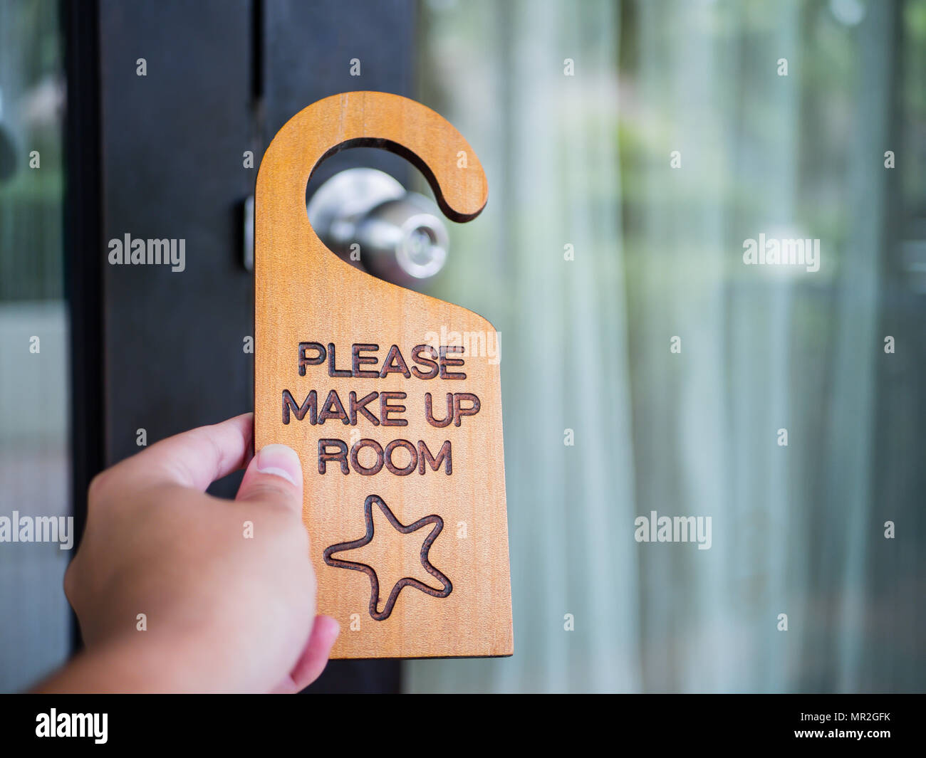 Signboard make up room hanging on open door in a hotel Stock Photo