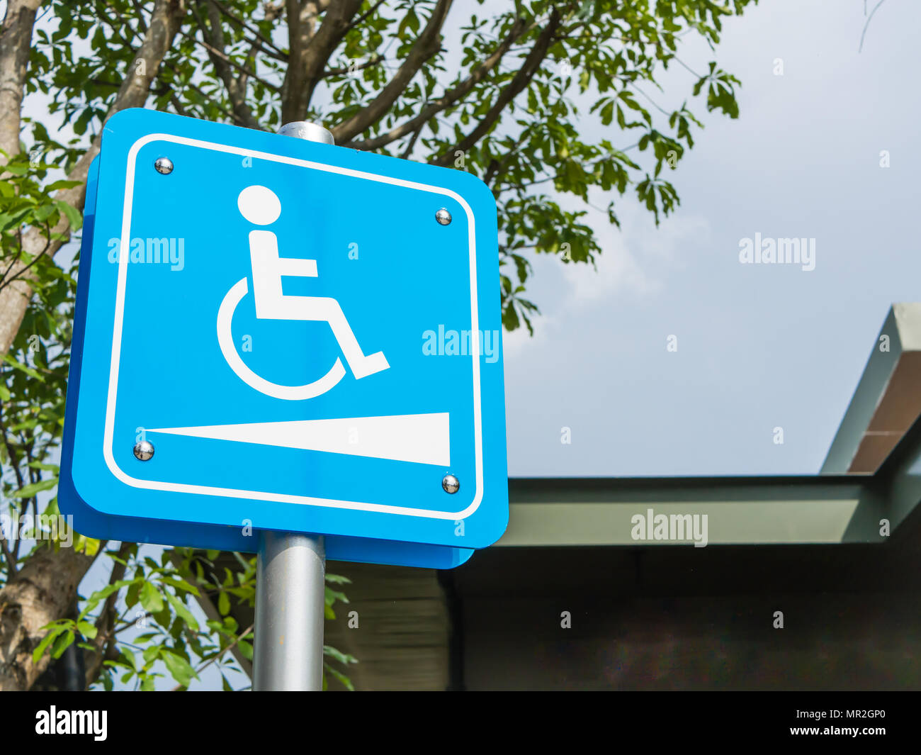 Wheelchair symbol in a parking lot. Stock Photo