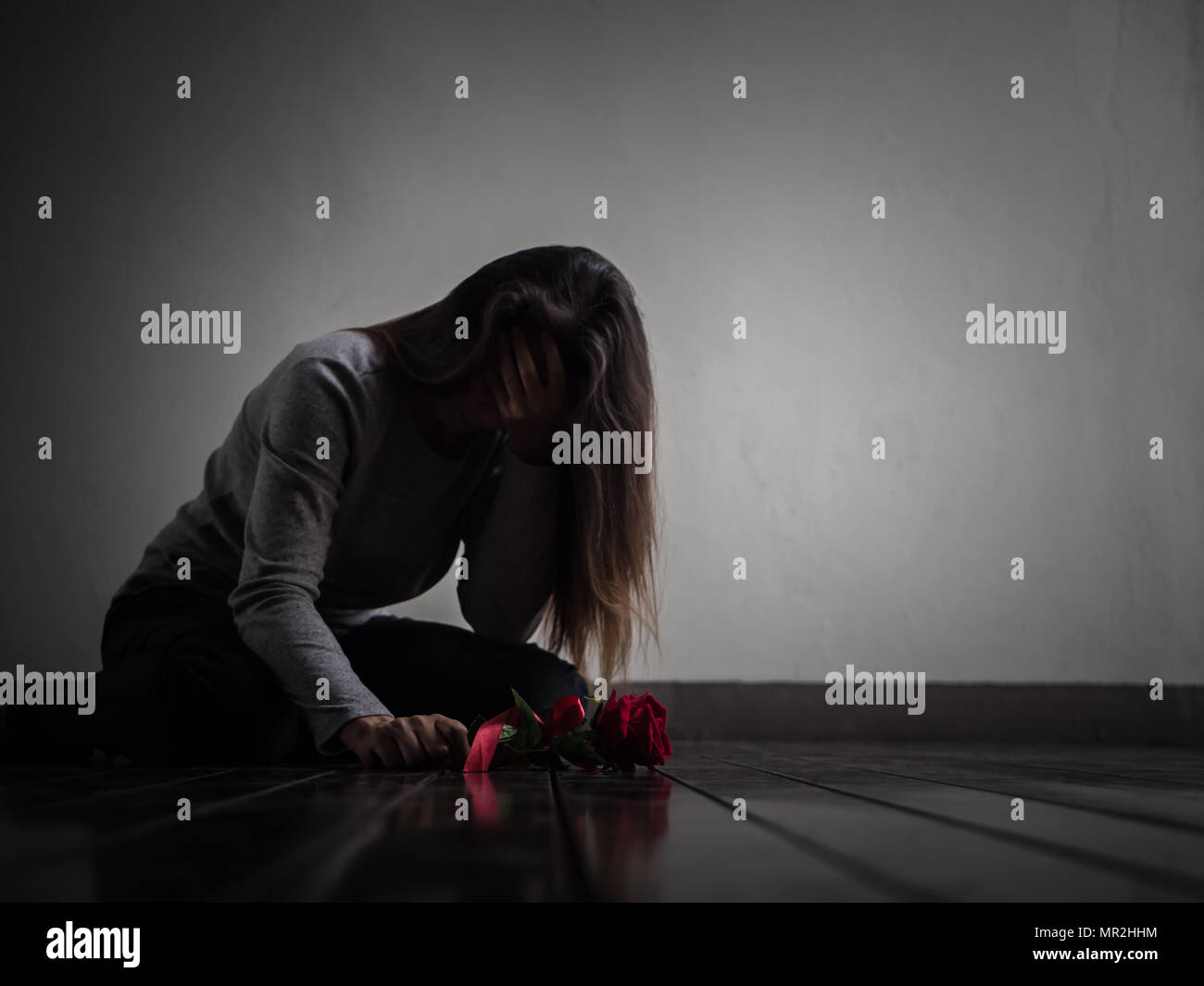 Sad Woman Sitting And Crying With Red Rose In Her Hand Lonly