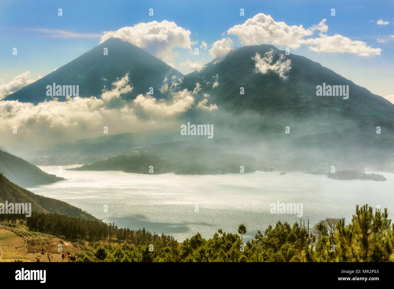 Landscape view at Lake Atitlan. At 1512m above sea level it is a body of water in a massive volcanic crater in Guatemala’s southwestern highlands. Stock Photo