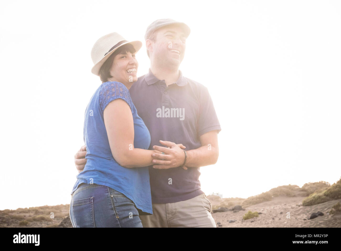 beautiful caucasian couple man woman hug and smile them outdoor in the ...