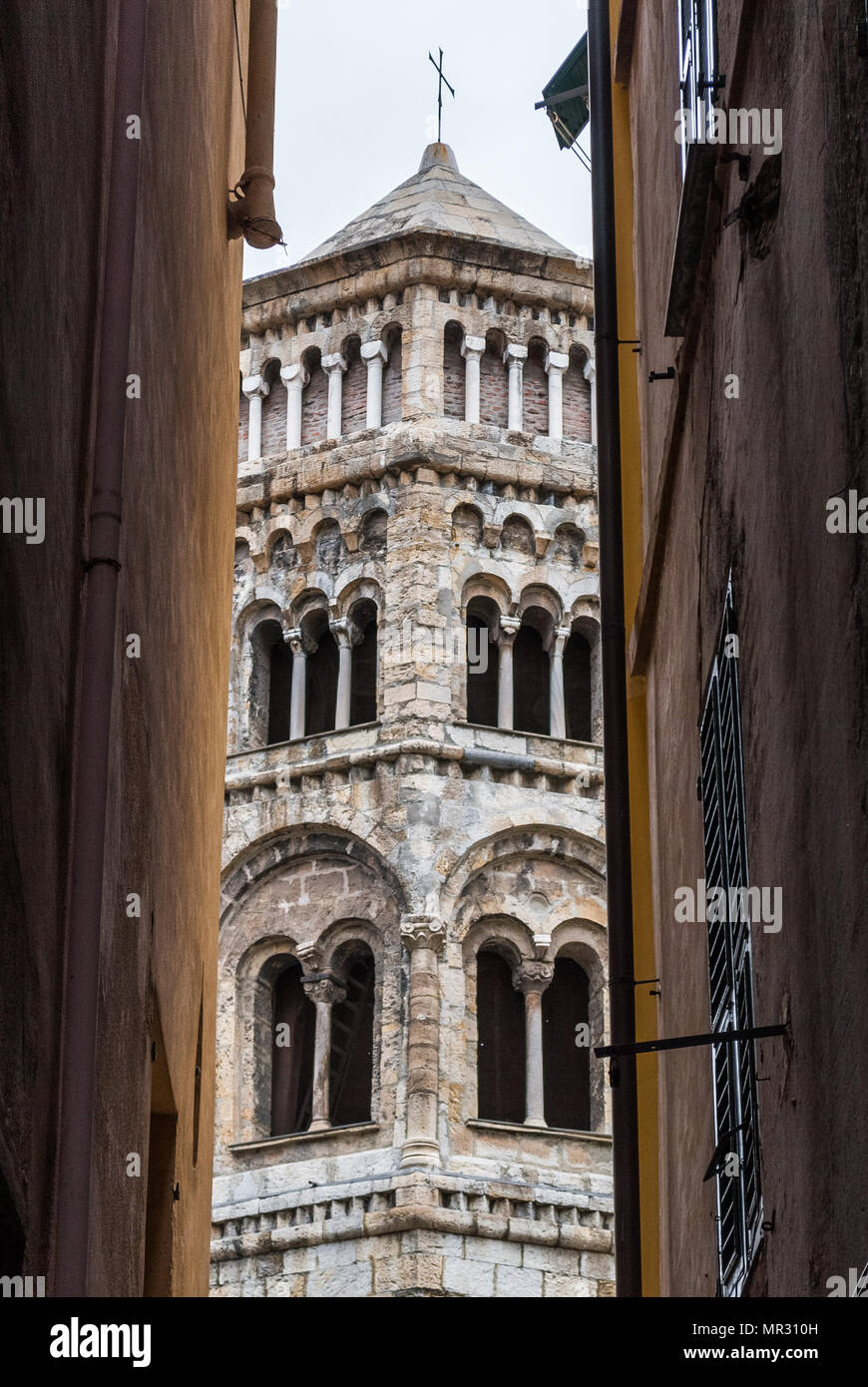 Glimpse of the bell tower of San Donato church in the downtown of Genoa Stock Photo