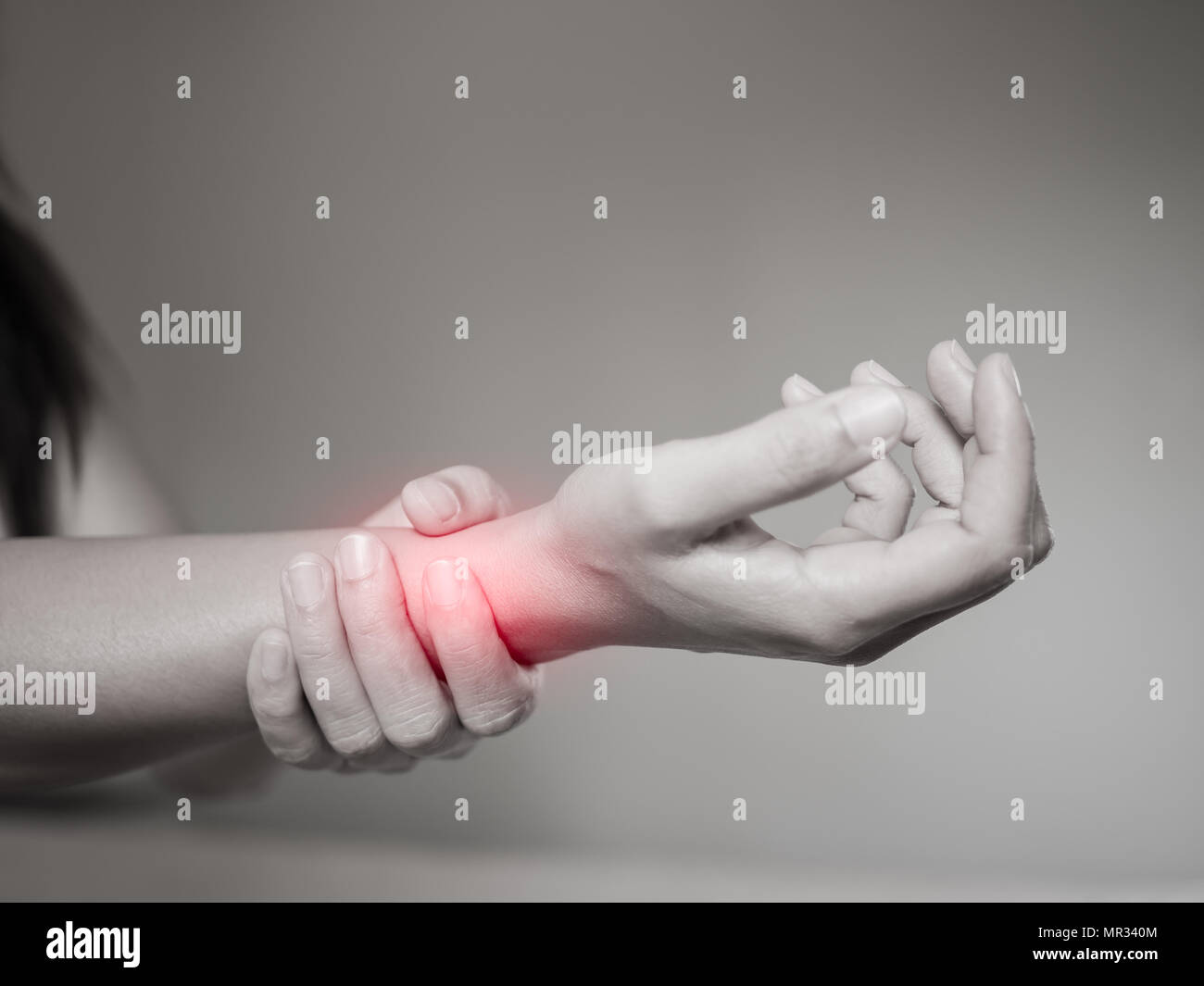 Black and white woman holds her wrist hand injury, feeling pain. Health ...