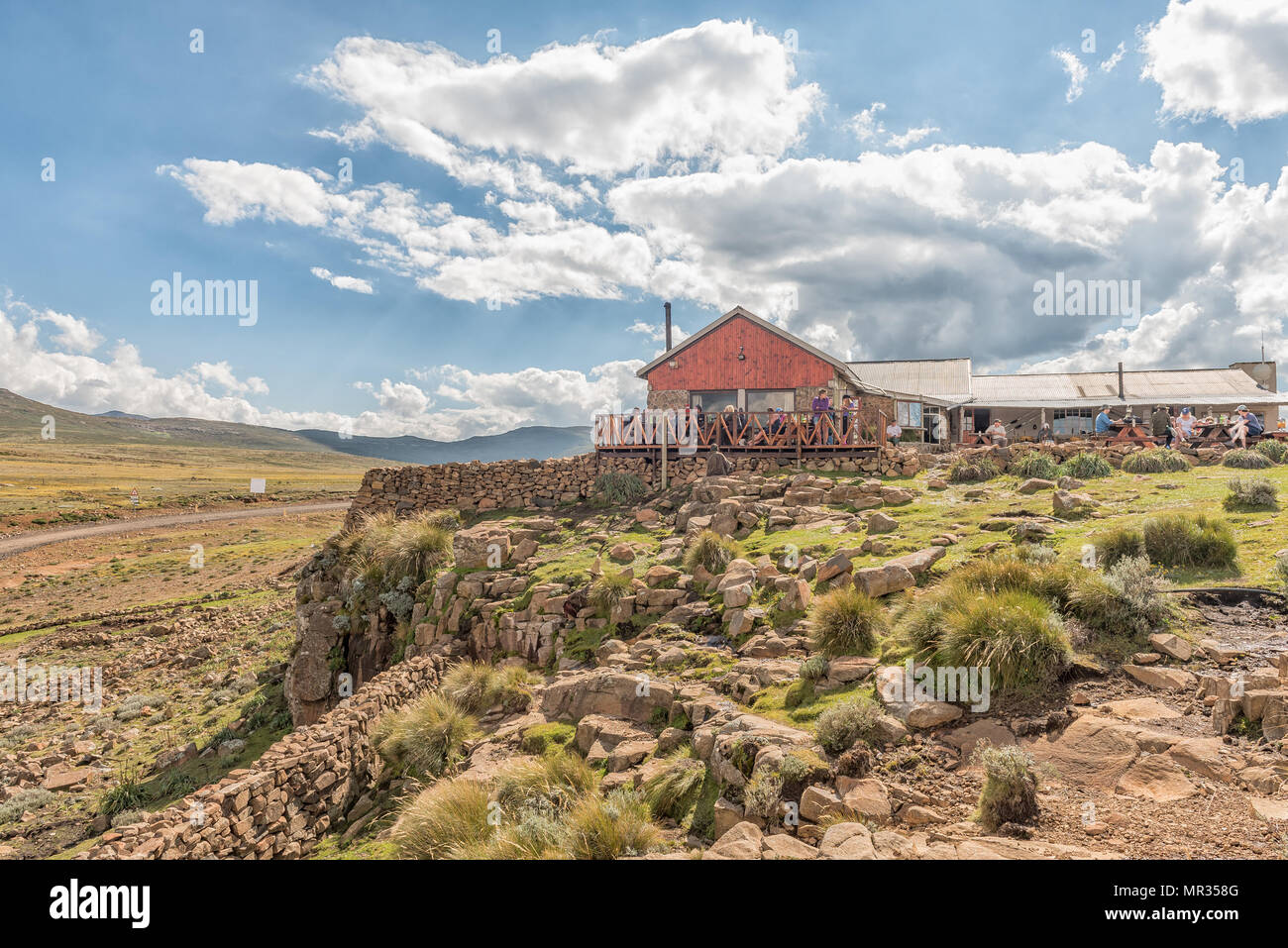 SANI TOP, LESOTHO - MARCH 24, 2018: Unidentified tourists at the Sani Mountain Lodge at the top of the Sani Pass. The lodge claims the title of highes Stock Photo