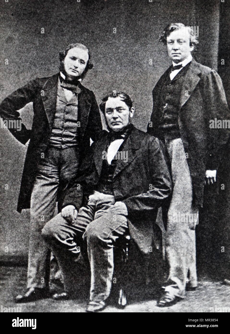 Photographic portrait of Gustav Kirchhoff, Robert Bunsen, and Henry Roscoe. Left to right: Gustav Kirchhoff (1824-1887) a German physicist, Robert Bunsen (1811-1899) a German Chemist, and Henry Roscoe (1833-1915) an English Chemist. Dated 19th century Stock Photo