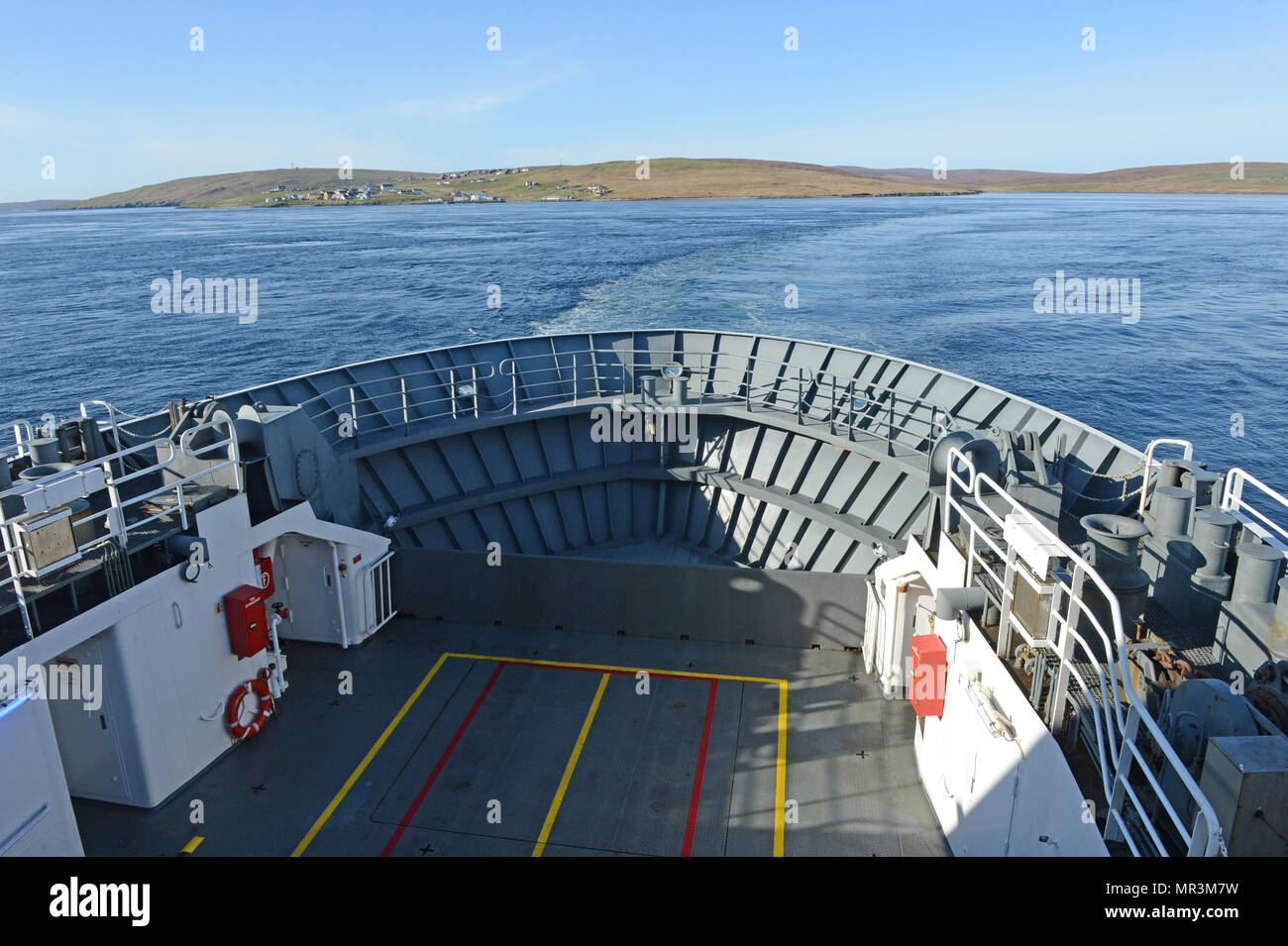 The Yell ferry that connects the mainland of Shetland to the island of Yell. Dropping off passengers and cars to the ferry terminal Stock Photo