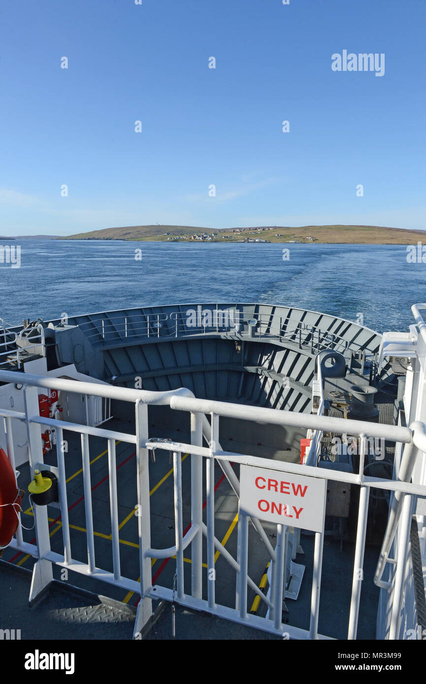 The Yell ferry that connects the mainland of Shetland to the island of Yell. Dropping off passengers and cars to the ferry terminal Stock Photo