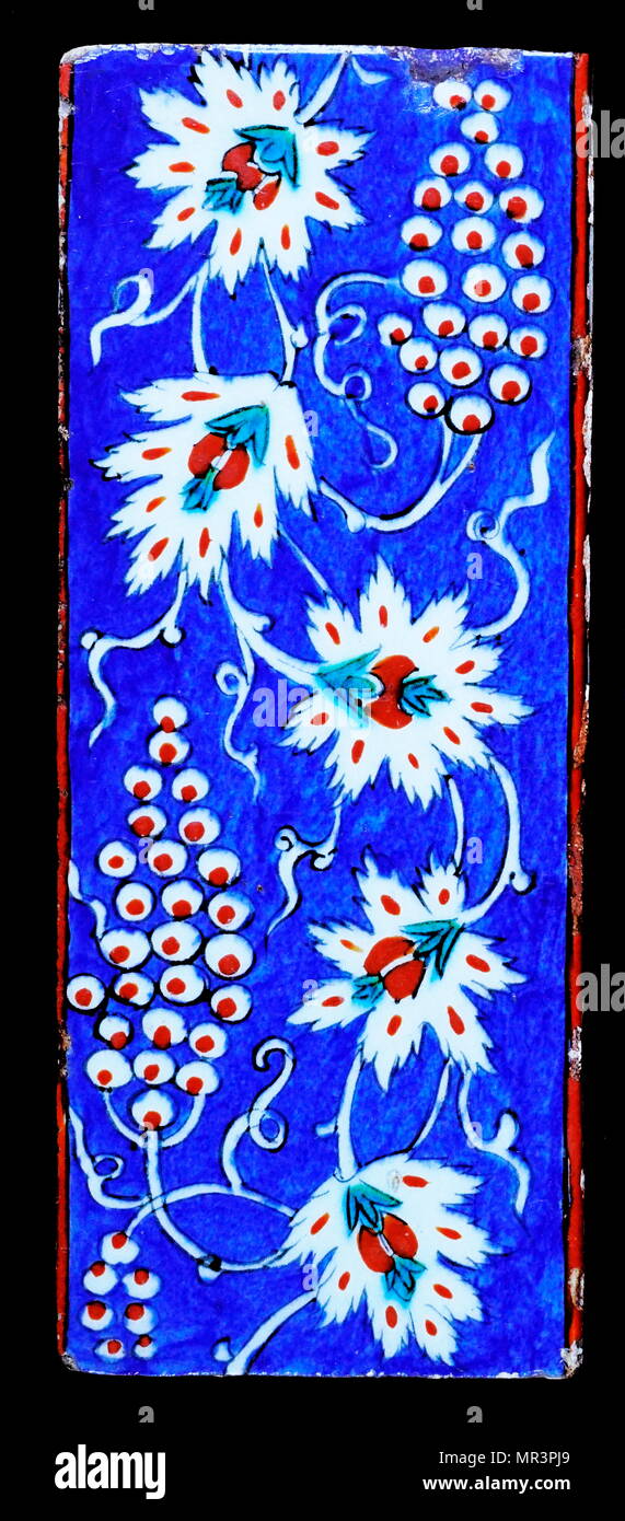 Iznik ceramic tile decorated with flowers. 1570. Iznik pottery, or Iznik ware, named after the town of İznik in western Anatolia (ottoman Turkey), where it was made, is a decorated ceramic that was produced from the last quarter of the 15th century until the end of the 17th century Stock Photo