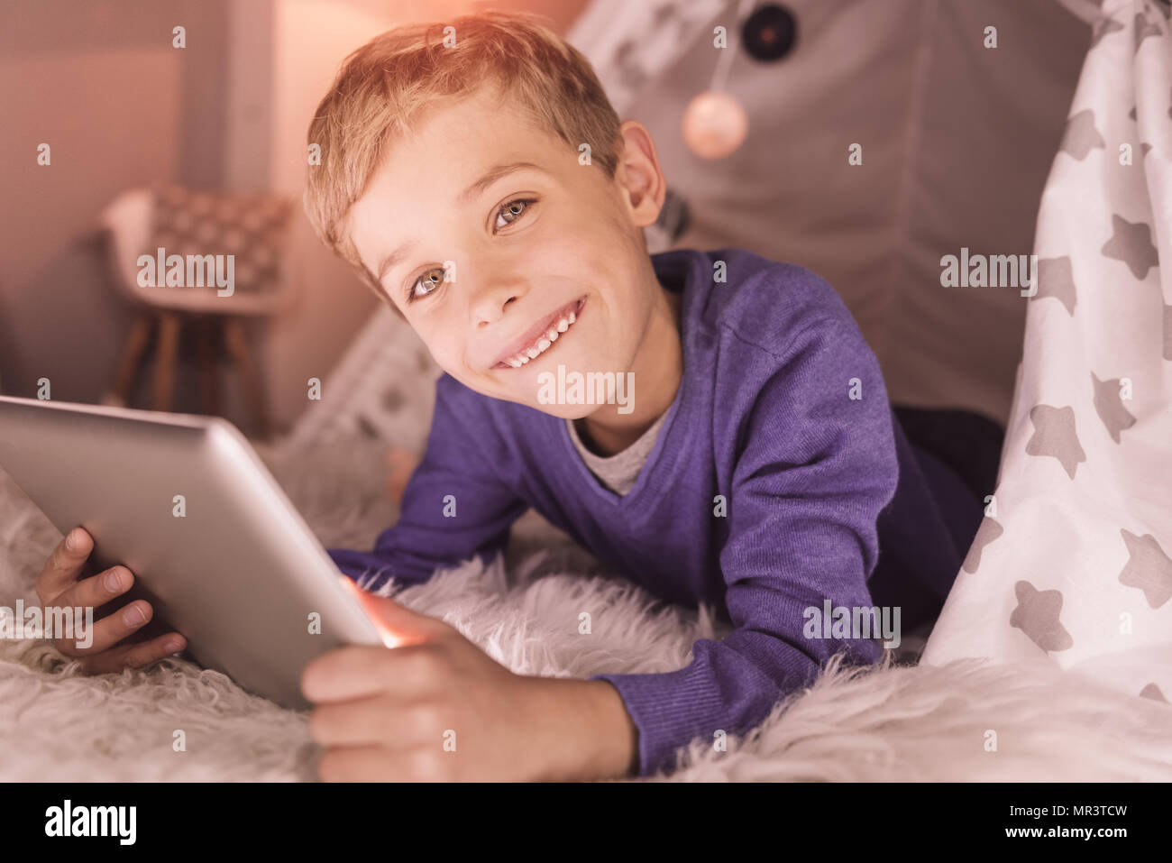 Pleasant cute boy enjoying his time Stock Photo - Alamy