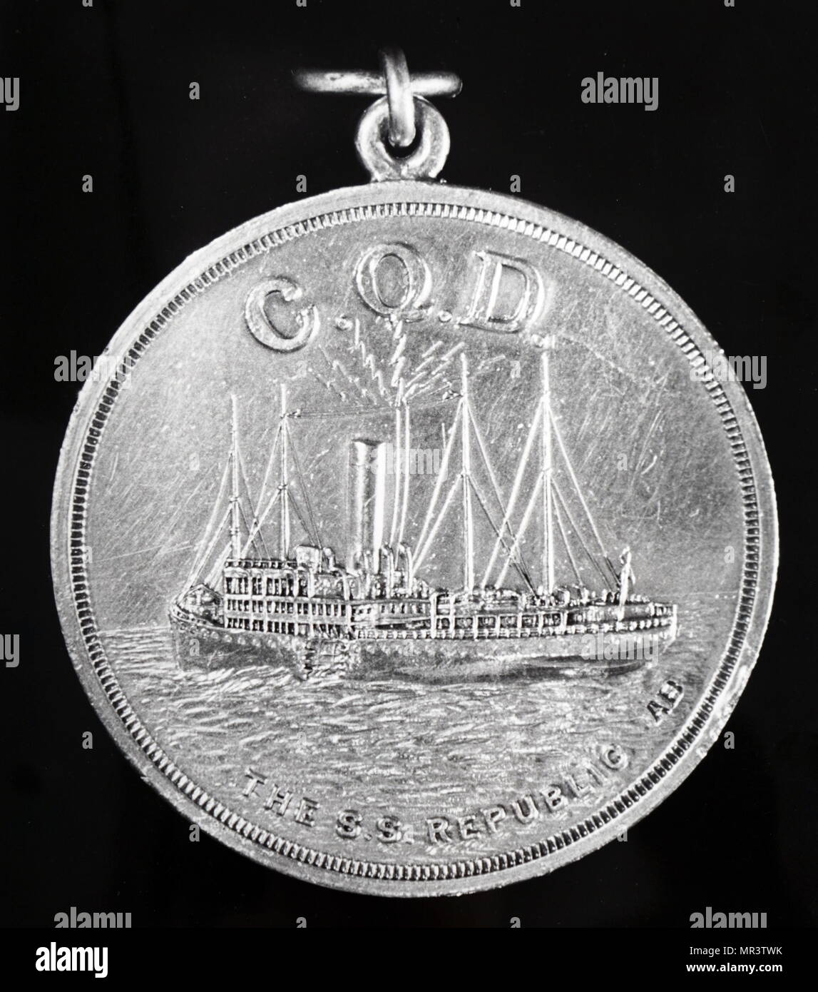 Silver medal struck to commemorate the first rescue at scene at sea brought about by a message sent by wireless telegraphy - 24 January 1909. The picture shows the SS Republic, after being struck in side by the SS Baltic sending a message. C.Q.D. was the emergency call sign before S.O.S. was adopted. Dated 20th century Stock Photo